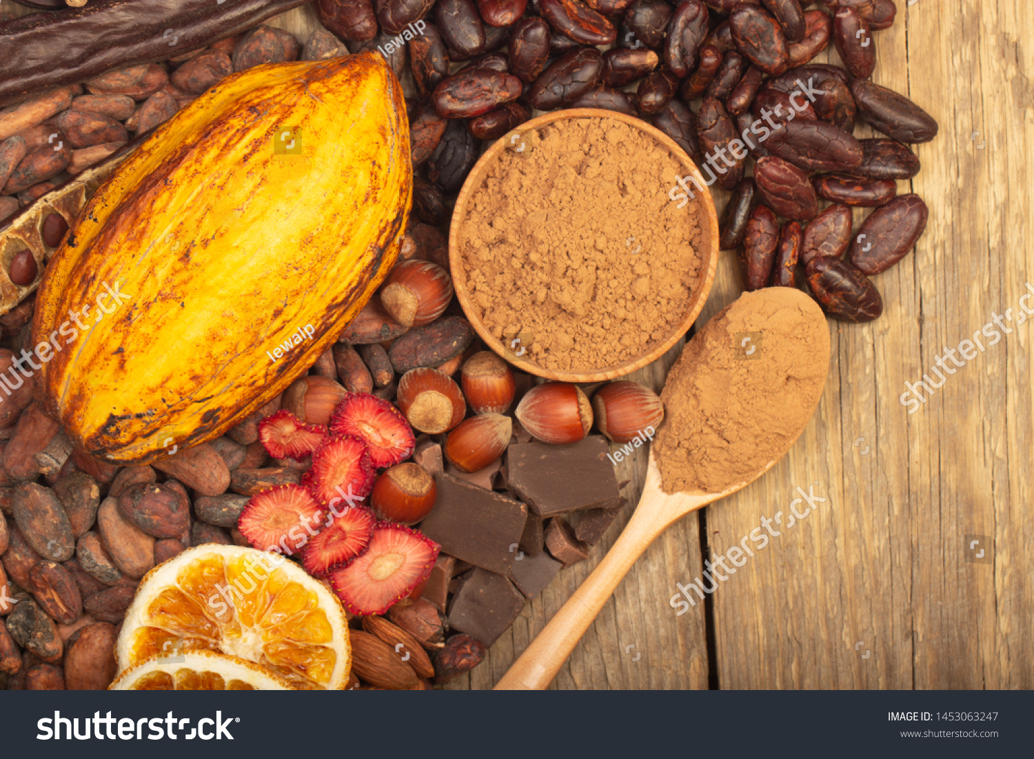 cacao pods, carob pods and dried fruits on wooden background #1453063247