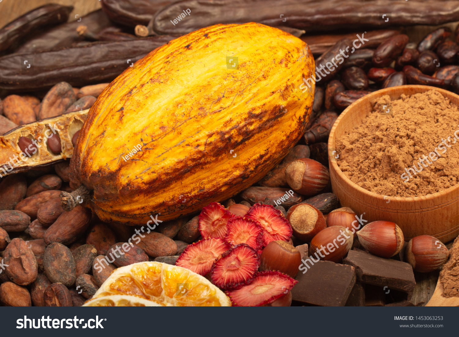 cacao pods, carob pods and dried fruits on wooden background #1453063253