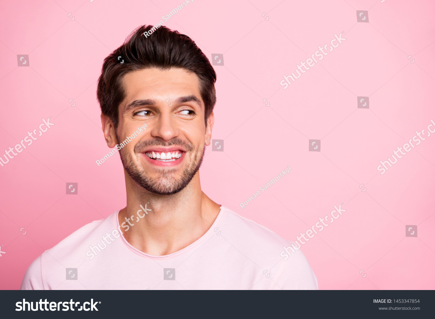 Closeup photo of amazing guy look silly empty space wearing casual outfit isolated on pink background #1453347854