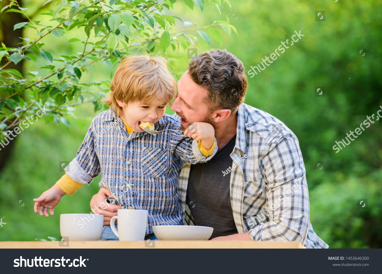 Nutrition habits. Family enjoy homemade meal. Family time. Nutrition kids and adults. Little boy and dad eat. Everything is more fun with father. Organic nutrition. Healthy nutrition concept. #1453646300