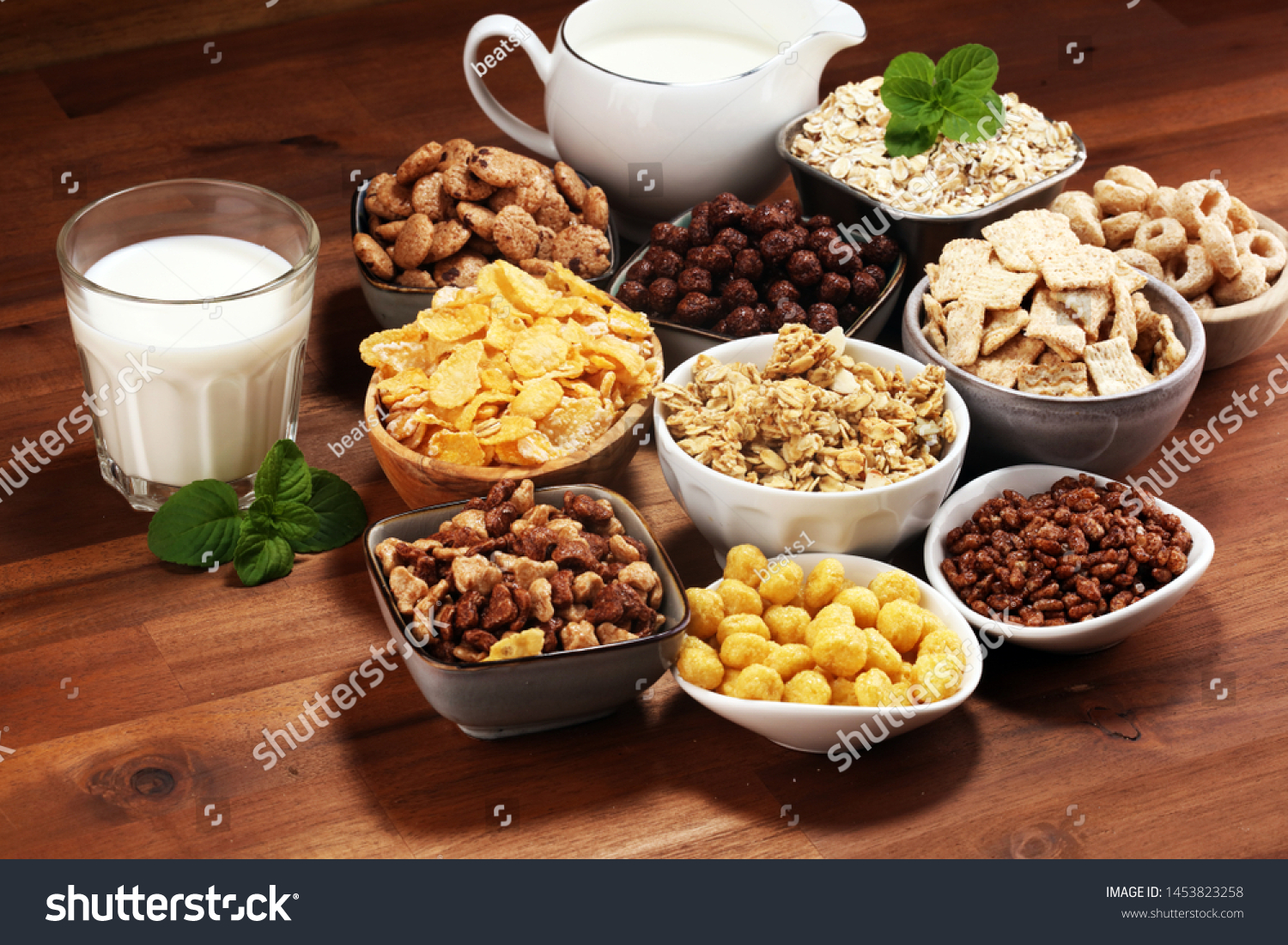 Cereal. Bowls of various cereals and milk for breakfast. Muesli with variety of kids cereals. #1453823258