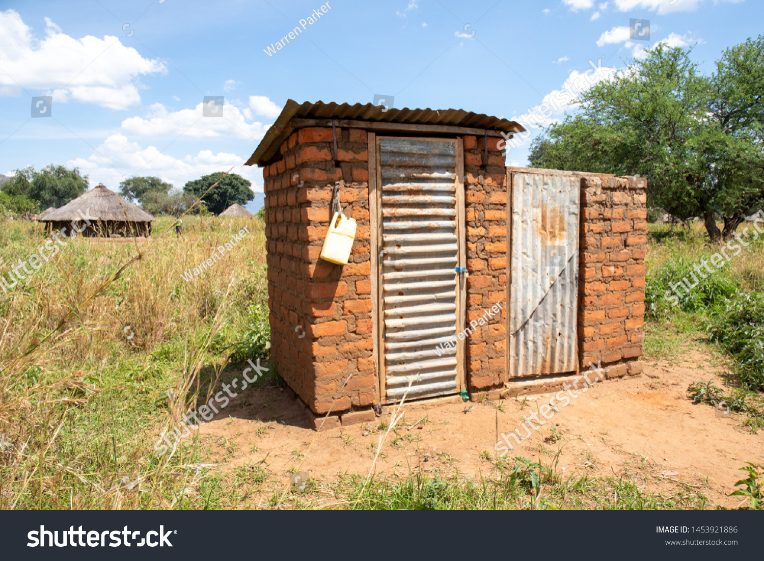 Outdoor latrine in rural uganda with hand washing station #1453921886