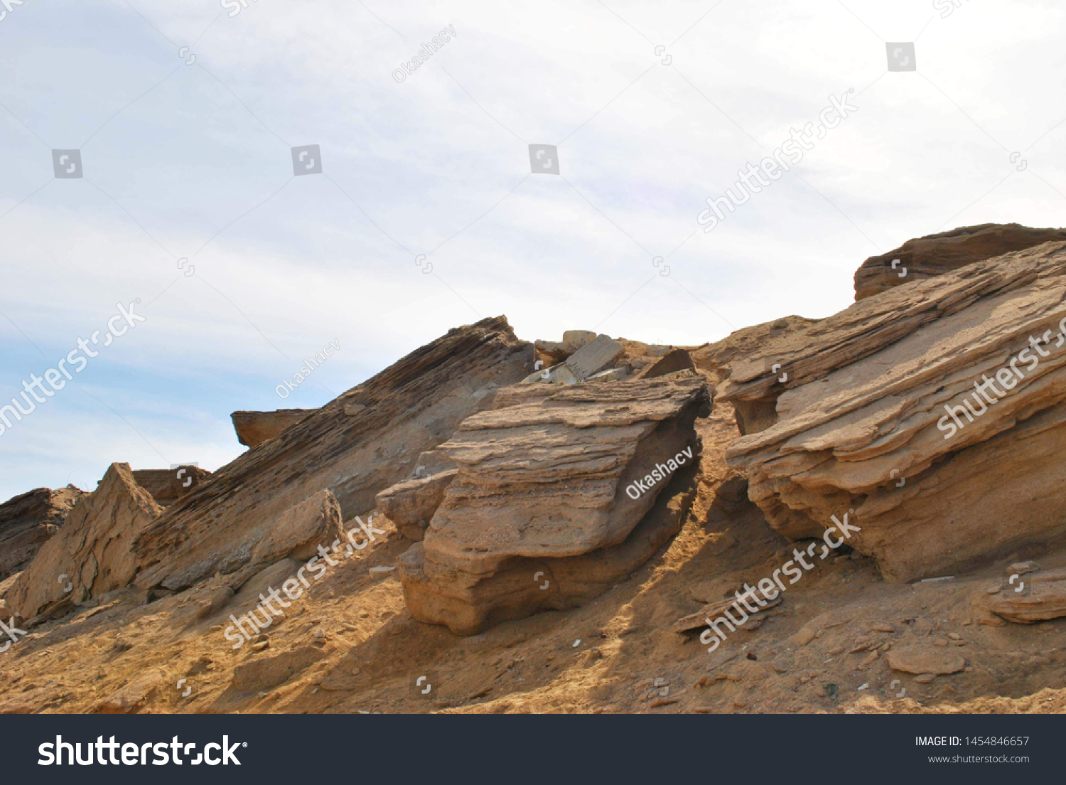 The top of the mountain with large stones on the background of a cloudy sky #1454846657