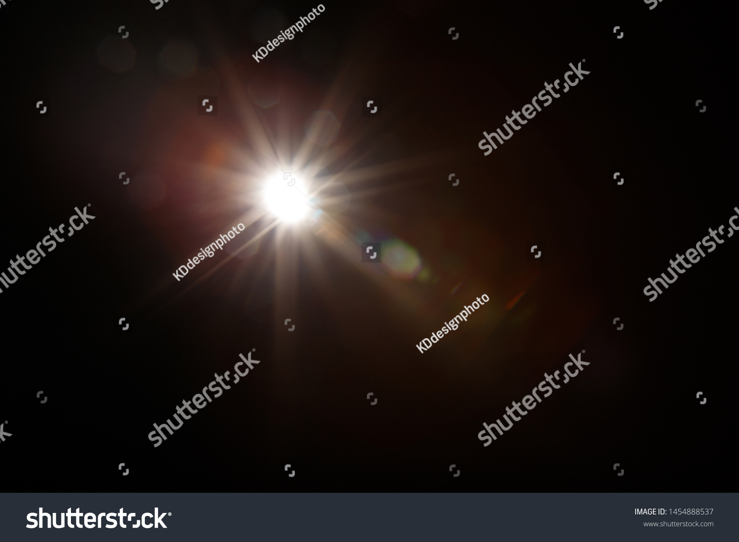 Lens Flare. Light over black background. Easy to add overlay or screen filter over photos. Abstract sun burst with digital lens flare background. Gleams rounded and hexagonal shapes, rainbow halo. #1454888537