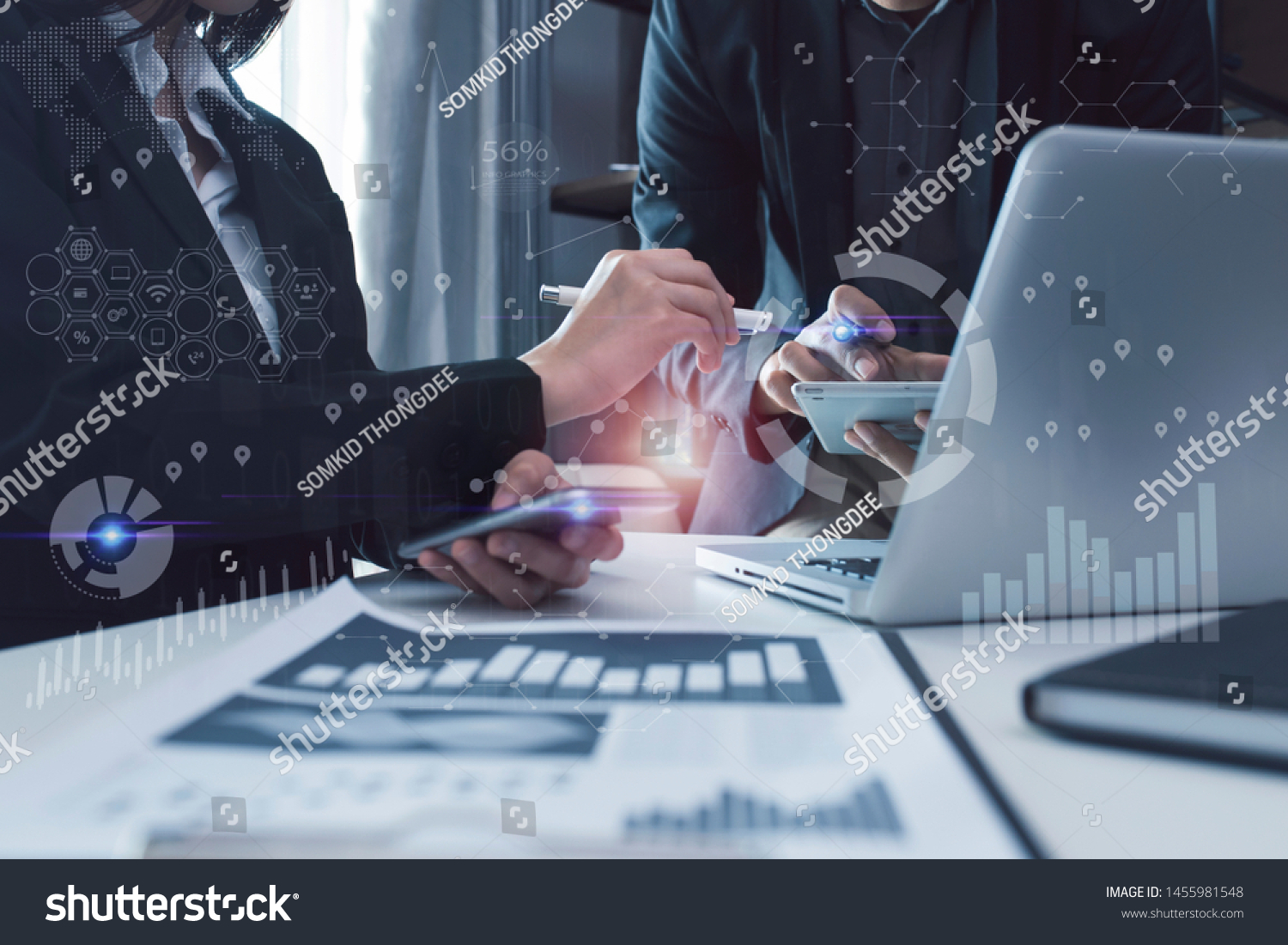 Concept of digital diagram, graph interfaces, Connections icon,Teamwork at business meeting, Business people working with laptop and tablet talking together in the modern Office. #1455981548