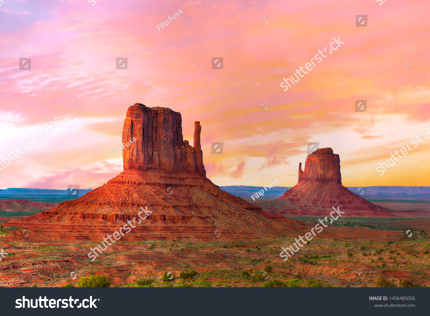 Beautiful sunset over the West and East Mitten Butte in Monument Valley. Utah, USA #1456485056