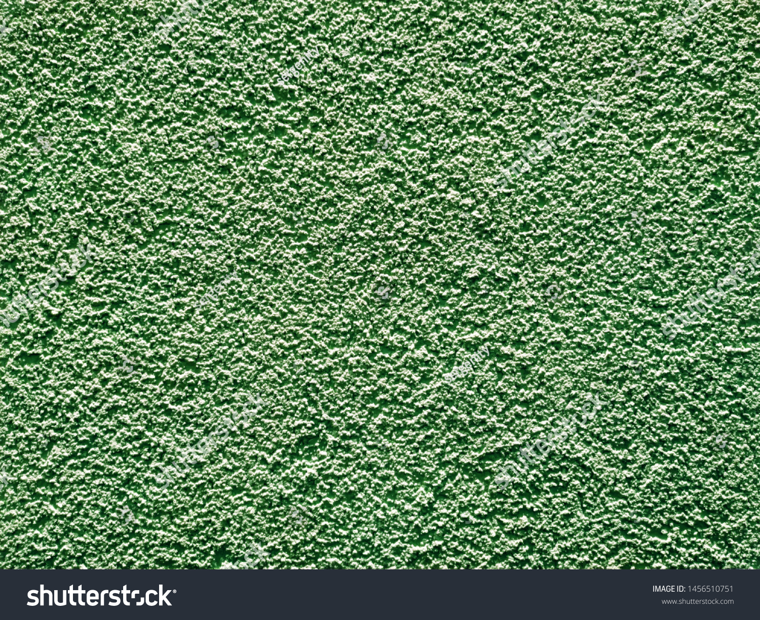 decorative background reminding decorative plaster or a decorative stone of greenish color or an old stone #1456510751