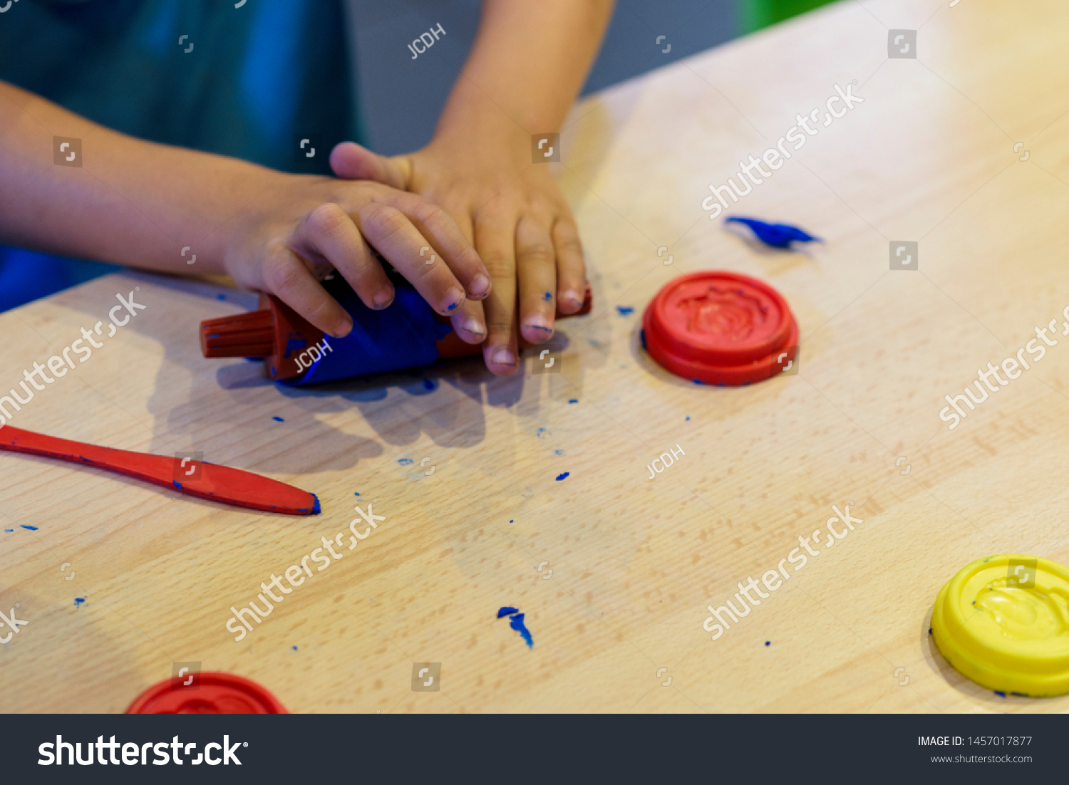 Child playing with plasticine. Craft games. Games for children. #1457017877