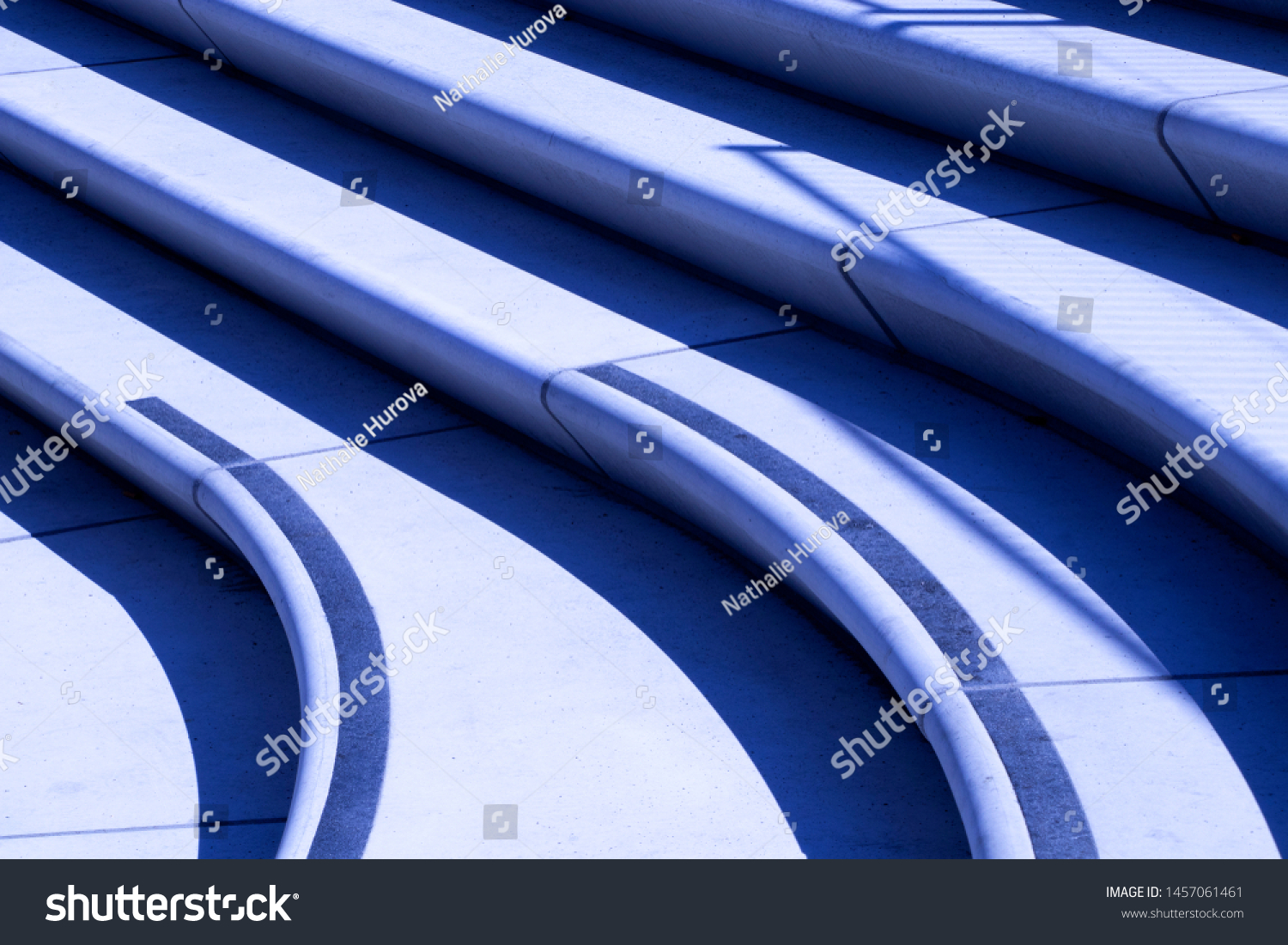 Modern street stairs in a blue color. A picture close-up. Outdoor design. Urban architecture. Bright background.  #1457061461
