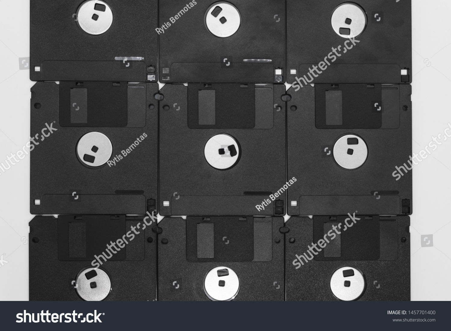 Background of bunch black floppy disks on white background #1457701400