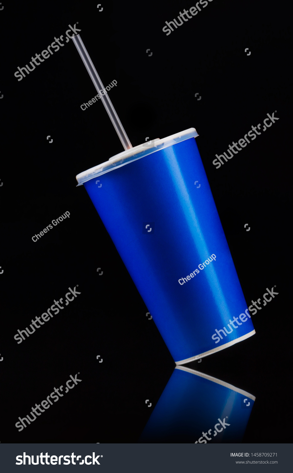 Blue cup with cap and tube isolated on black background. Concept of refreshments in cinema or watching movies #1458709271