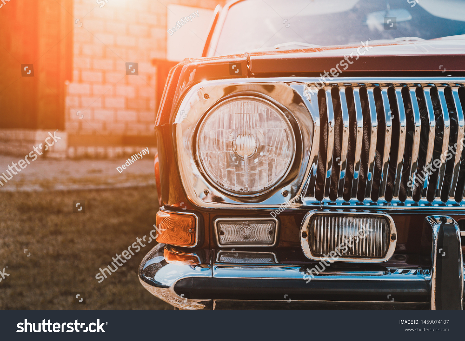 Close up of headlight of custom tuned classic retro lowrider car in sunlight, toned #1459074107