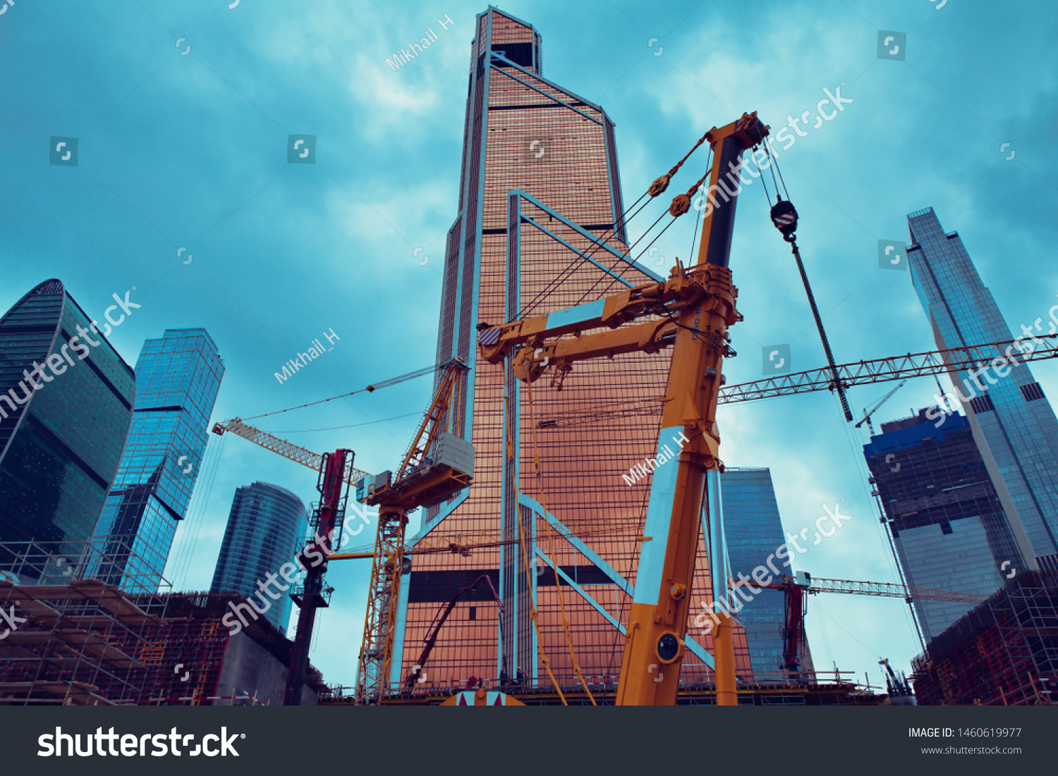 Sky scraper tower construction site with cransSky scrappers construction site #1460619977