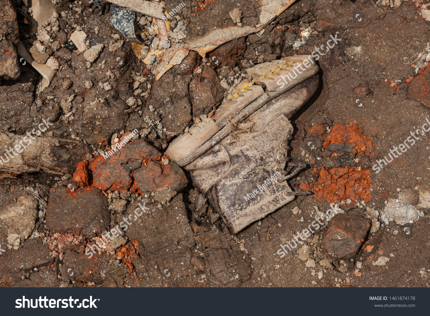 Single boot pushed into the ground found amongst dirt and rubble after the earthquake in Kathmandu n 2015 #1461874178