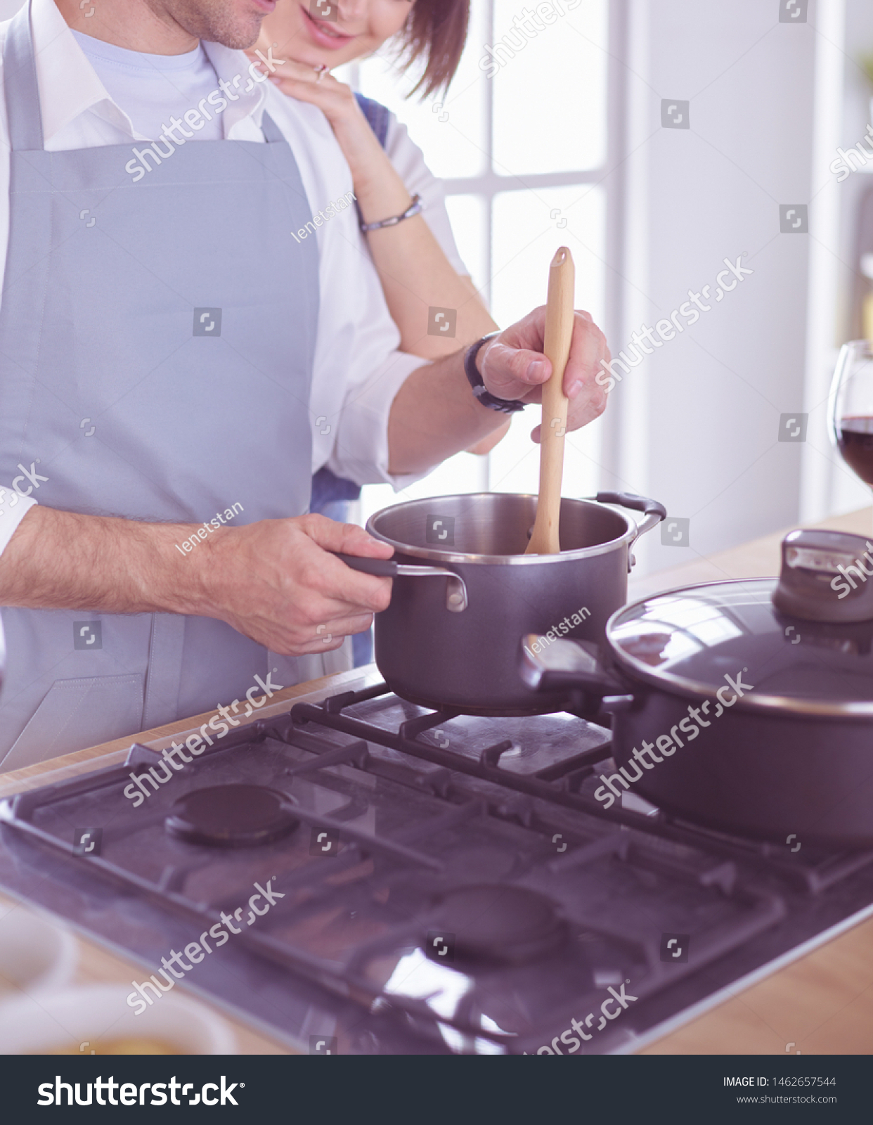 Couple cooking together in the kitchen at home #1462657544