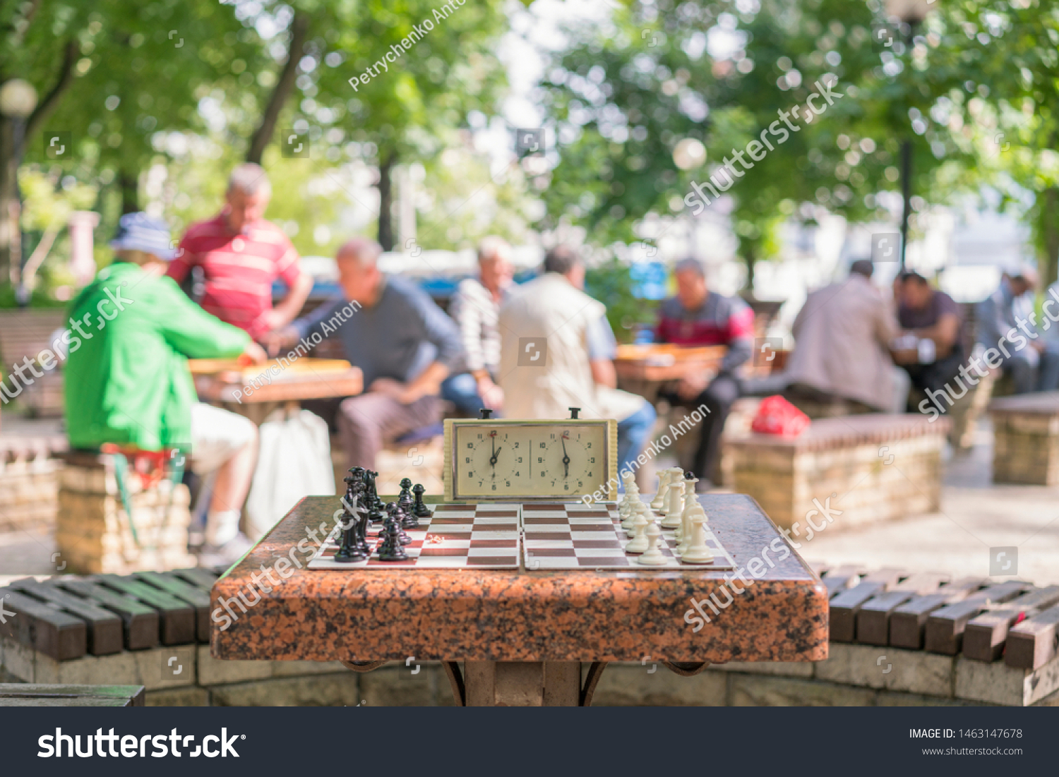Chess board with pieces and clock on wooden desk In connection with the chess tournament. Chess tournament with chess clock on wooden table #1463147678