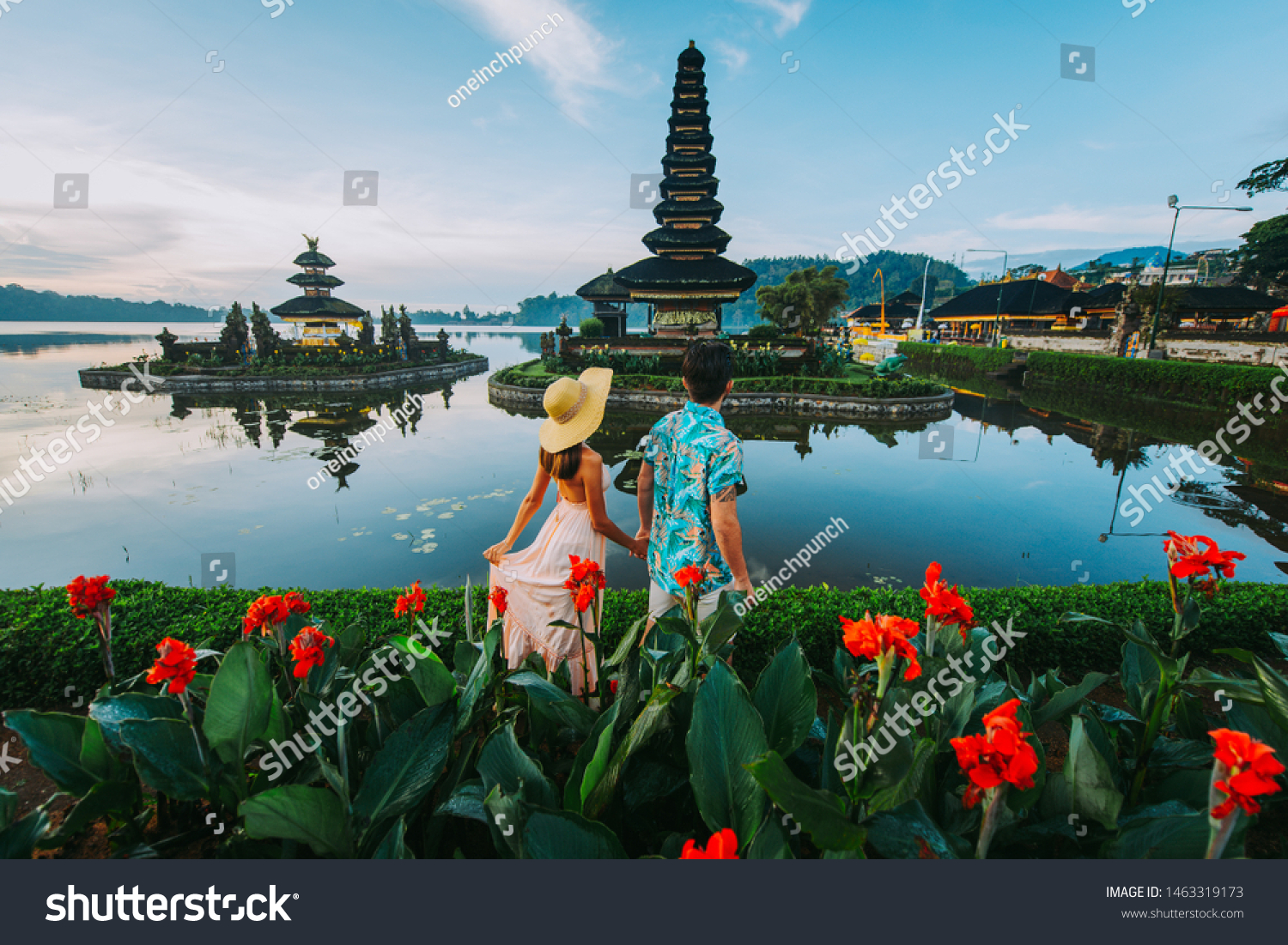 Couple spending time at the ulun datu bratan temple in Bali. Concept about exotic lifestyle wanderlust traveling