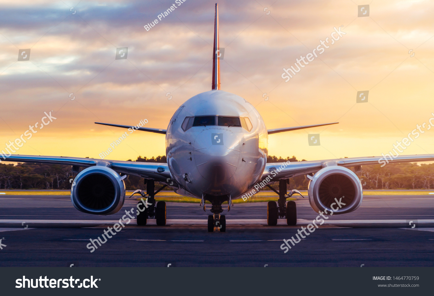 Sunset view of airplane on airport runway under dramatic sky in Hobart,Tasmania, Australia. Aviation technology and world travel concept. #1464770759