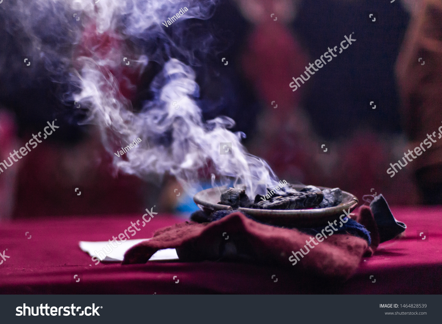 Fusion of cultural & modern music event. A close up view of embers smoking in a sacred dish during a festival of Native American cultures and traditions mystical object used by shaman, with copy space #1464828539