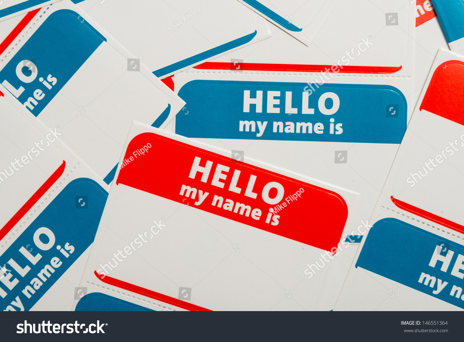 A stack of blue and red "Hello, my name is" name tags or badges #146551364