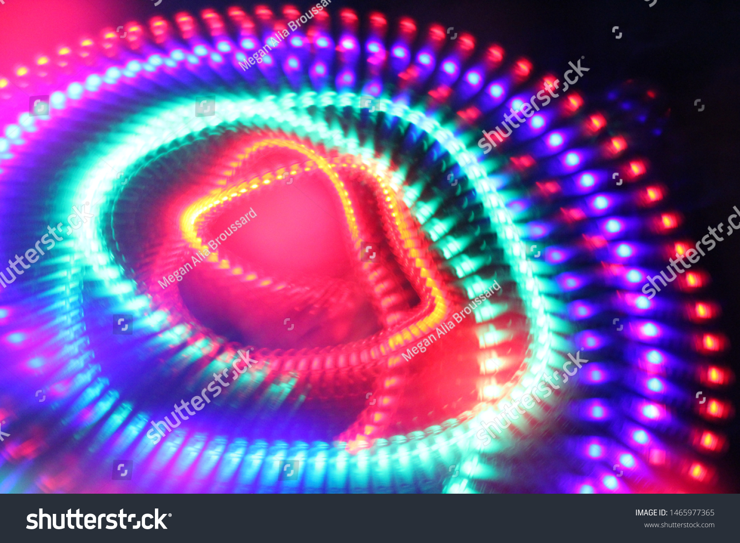 Moving, spinning led lights. Abstract idea of the atom’s nucleus and orbiting electrons as an electron cloud.  #1465977365
