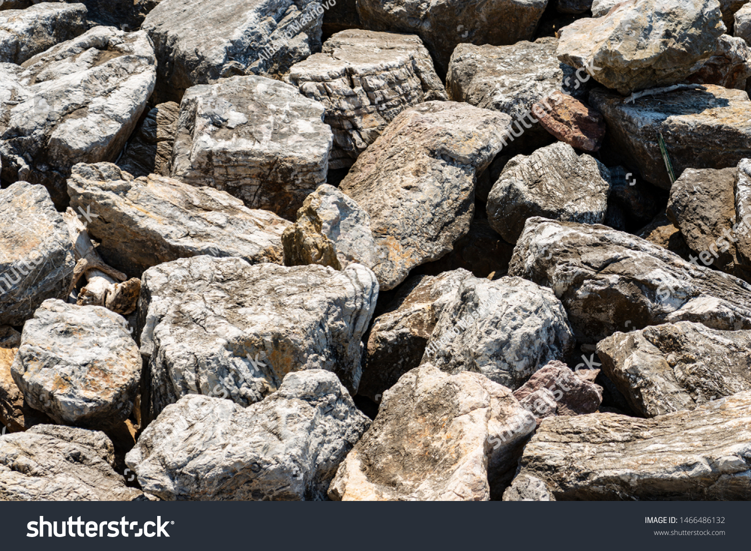 Closeup of a breakwater made of giant boulders by the sea, full frame. Liguria, Italy, Europe #1466486132
