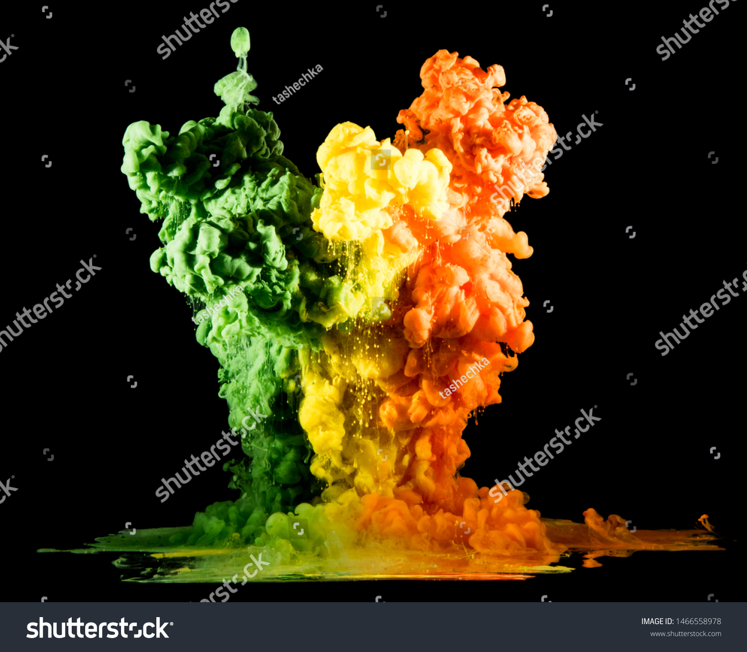 Colorful rainbow paint drops from above mixing in water. Ink swirling underwater #1466558978