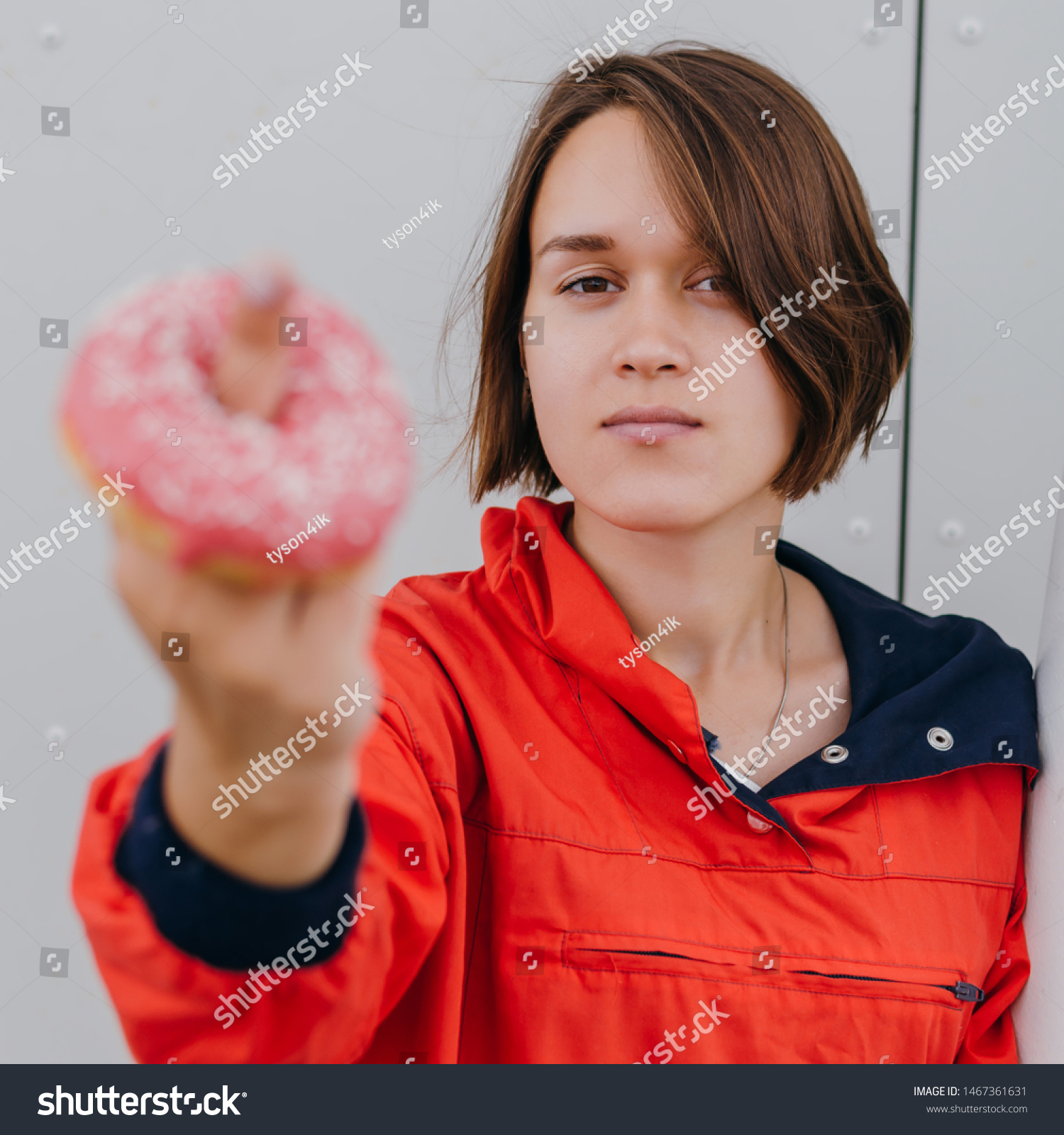 Beautiful woman showing fuck with donut Diet diet concept. Junk food, weight loss. #1467361631