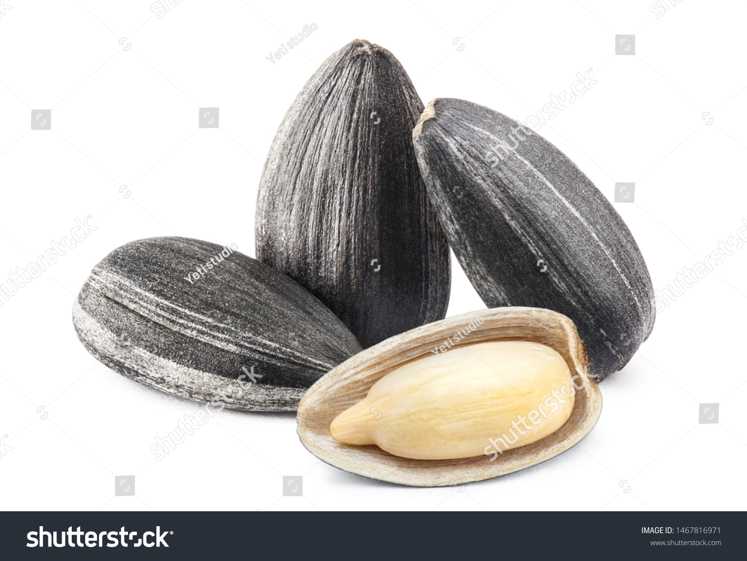 Close-up of delicious sunflower black seeds, isolated on white background #1467816971