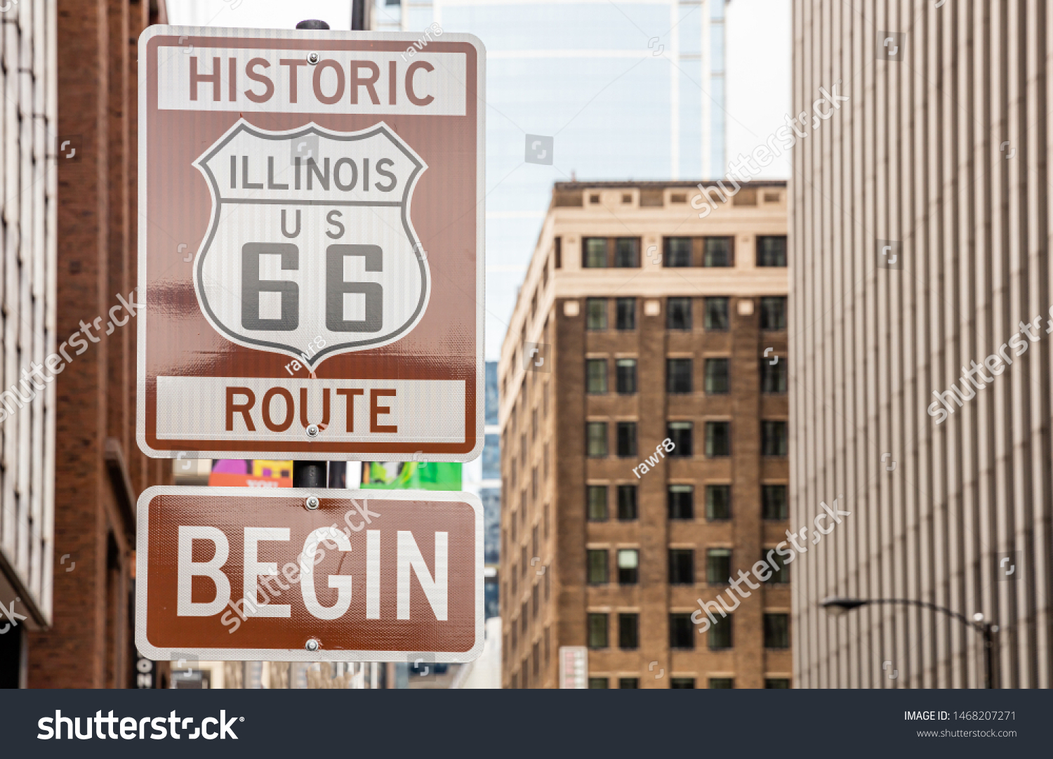 Route 66 Illinois Begin road sign at Chicago city downtown. Buildings facade background. Route 66, mother road, the classic historic roadtrip in USA #1468207271