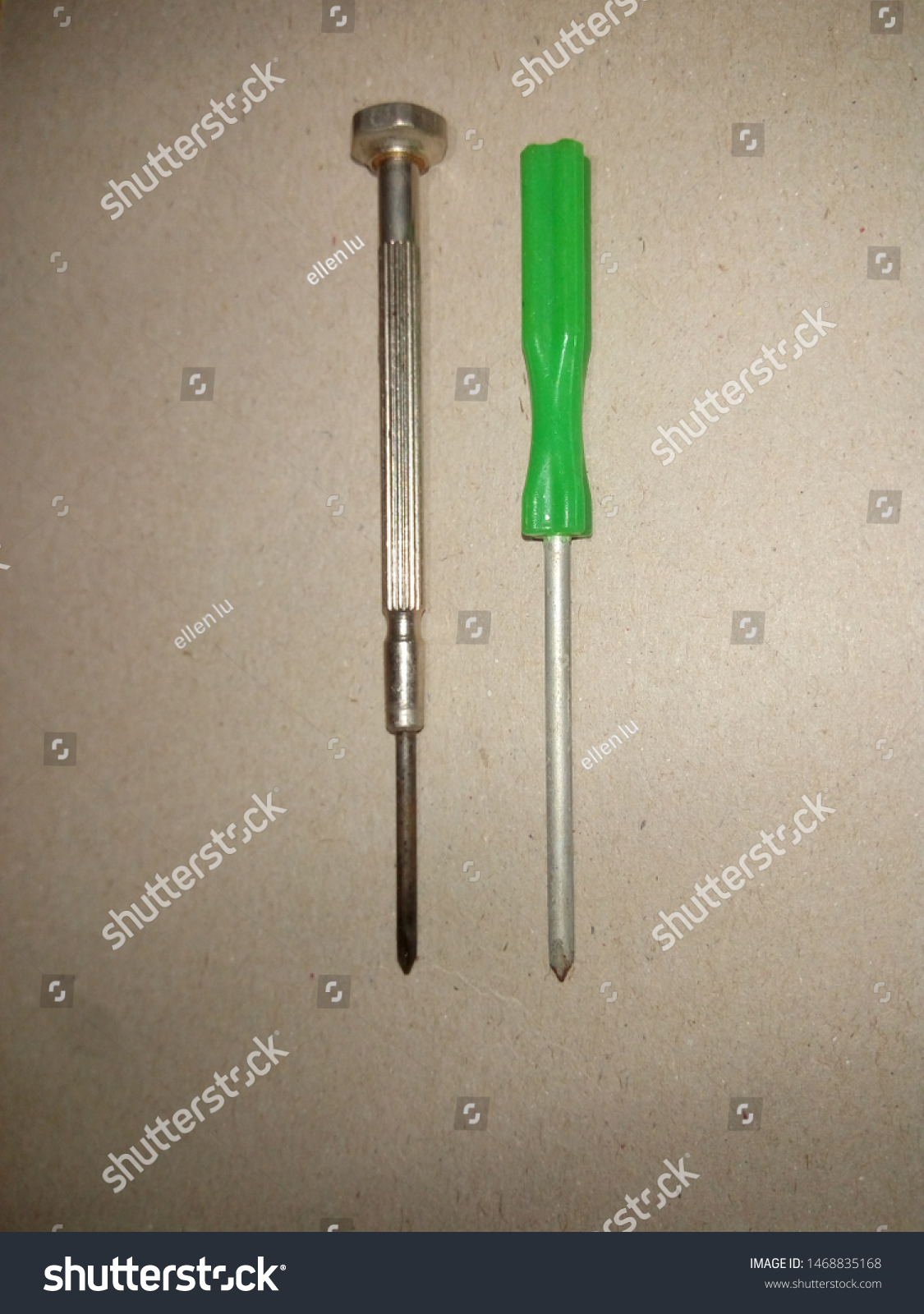 two screwdriver ,head screwdriver with green plastic handle and Precision screwdriver ,on gray background #1468835168