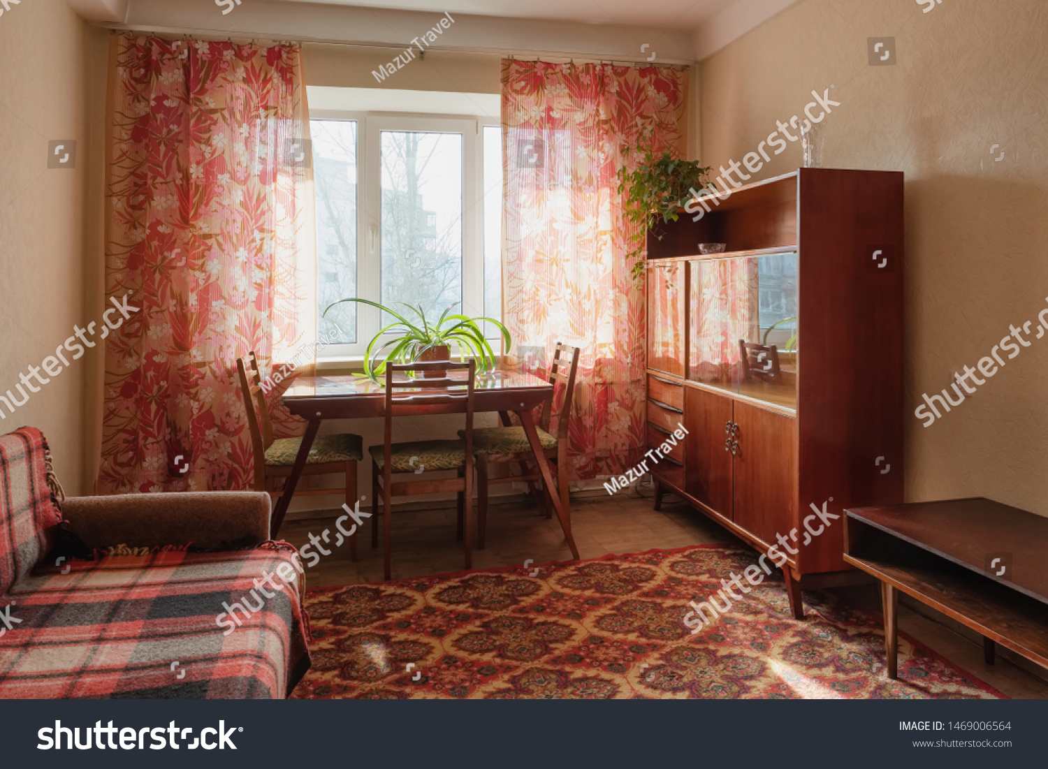 Interior of typical soviet style apartment. Old furniture and retro design #1469006564