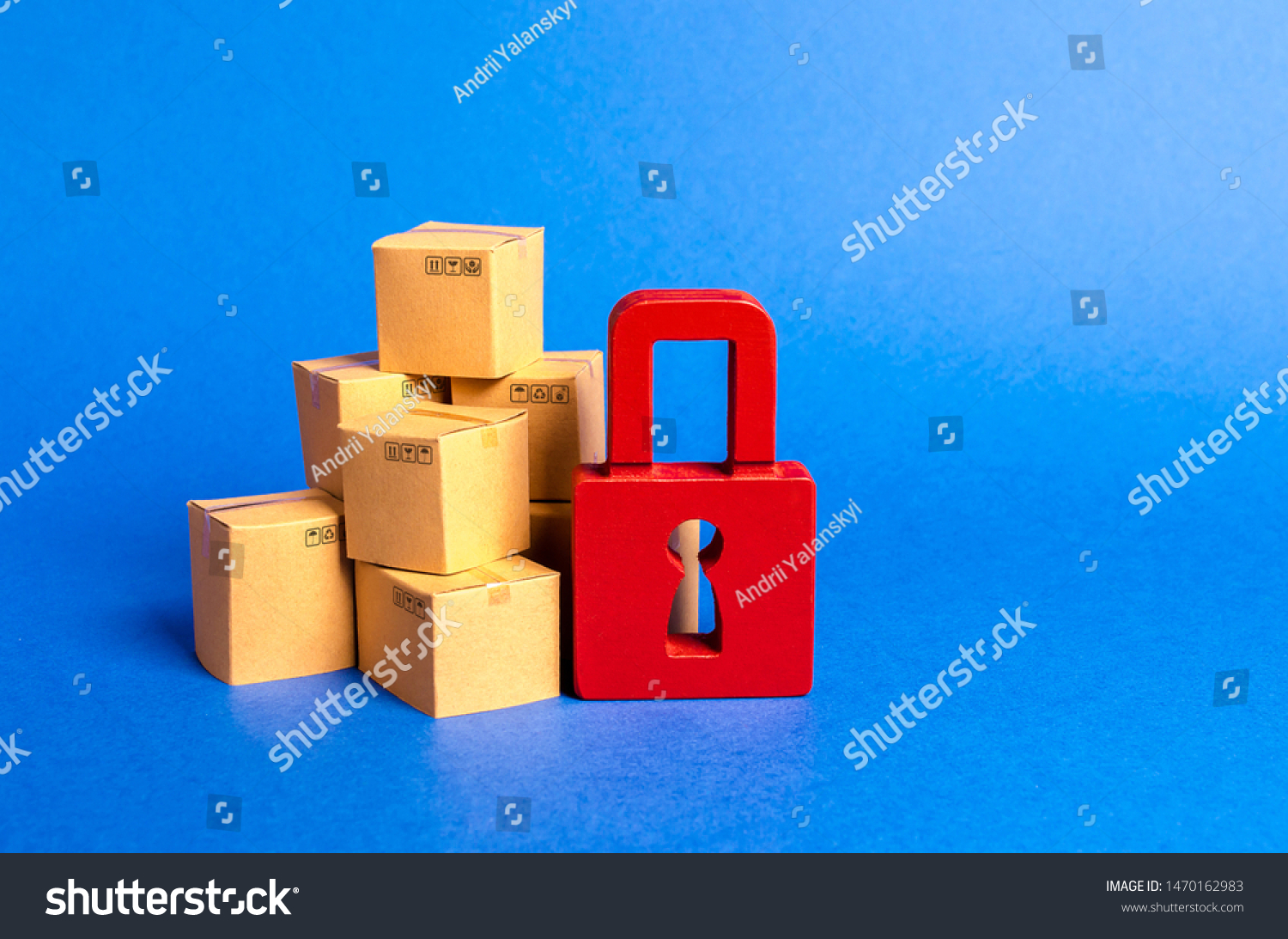 A stack of cardboard boxes and a red padlock. concept of insurance purchases. Consumer rights Protection. cargo arrest customs clearance. ban on the import. Providing warranty on purchased products. #1470162983