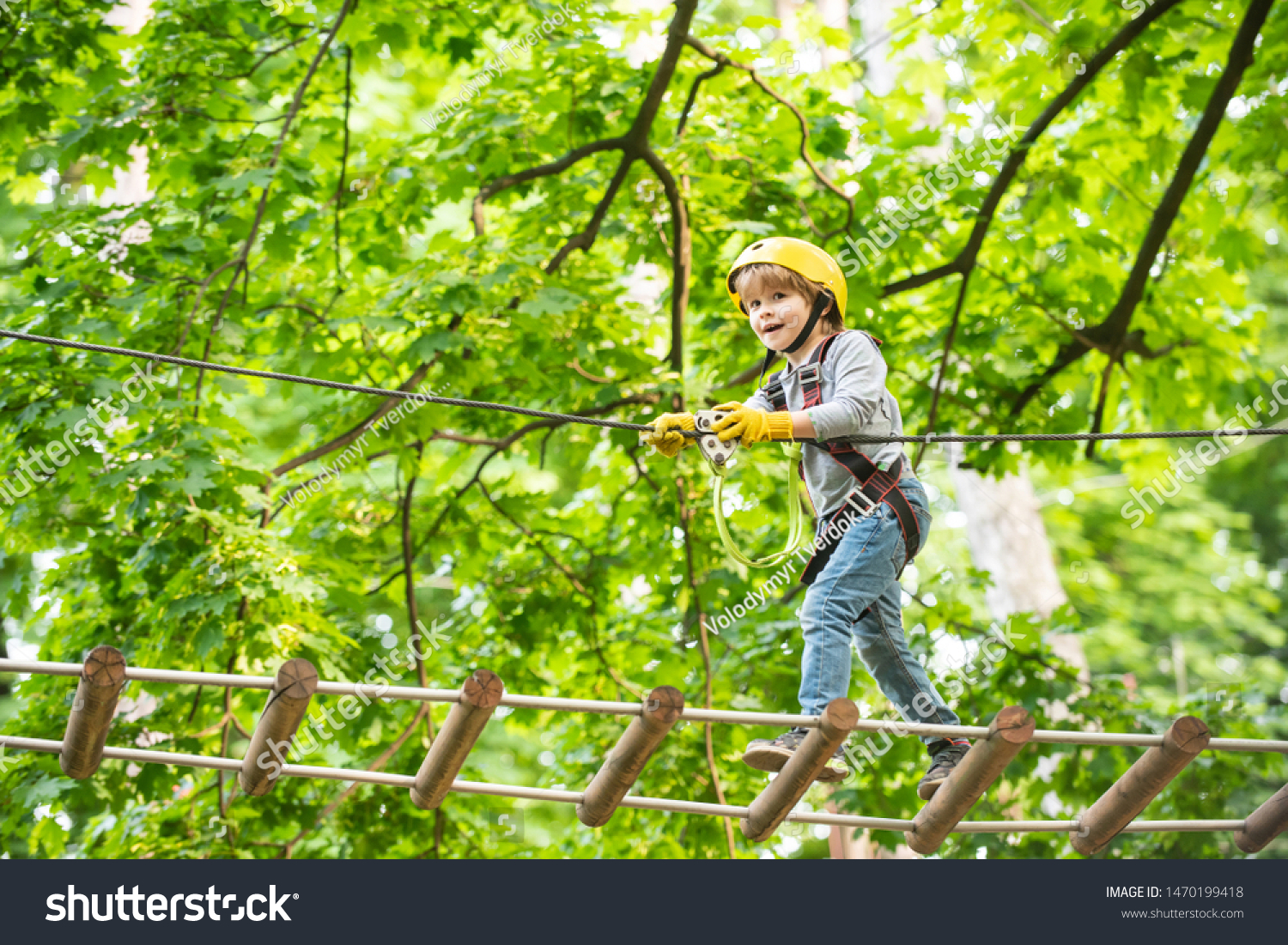 Rope park - climbing center. Child boy having fun at adventure park. Go Ape Adventure. Child boy having fun at adventure park. #1470199418