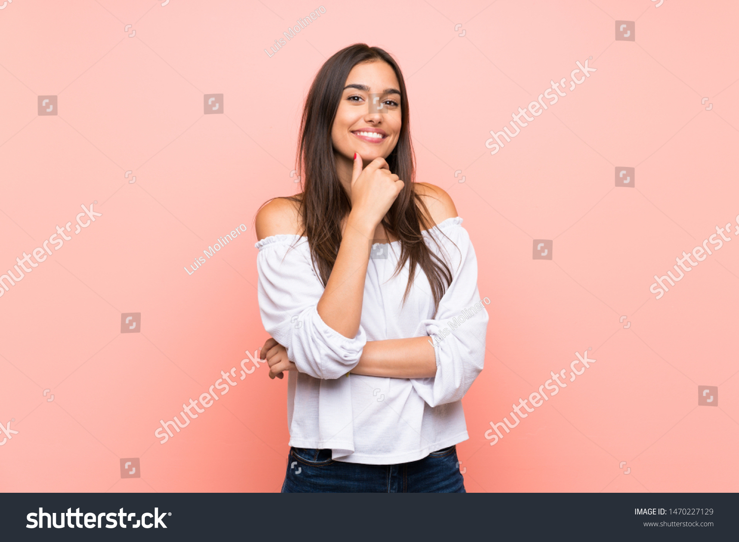 Young woman over isolated pink background smiling #1470227129