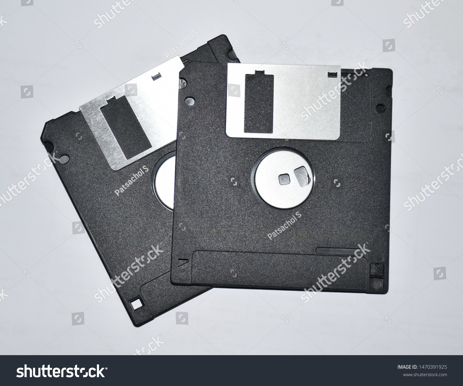 Old black square floppy disks, isolated on a white background. #1470391925