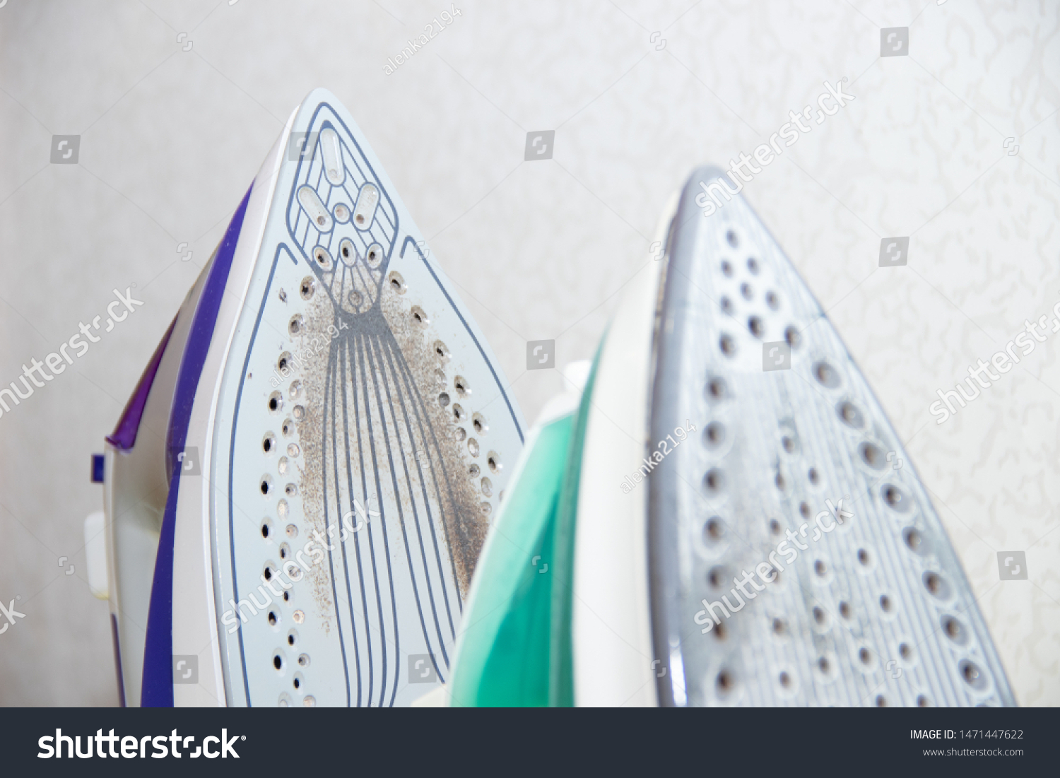 Two irons on an ironing board. Selection and comparison of irons. Ironing board. #1471447622