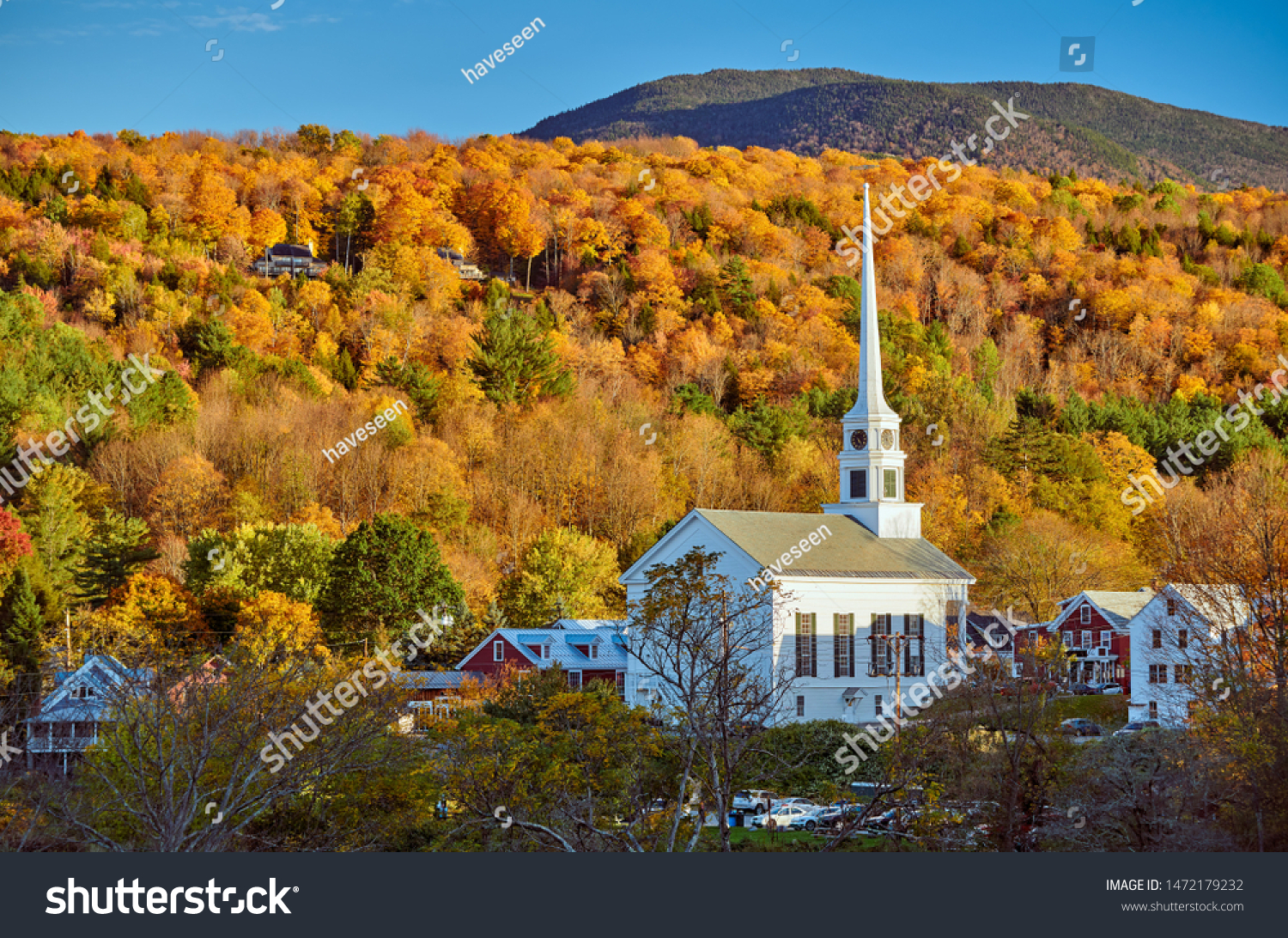 Iconic New England church in Stowe town at autumn in Vermont, USA  #1472179232