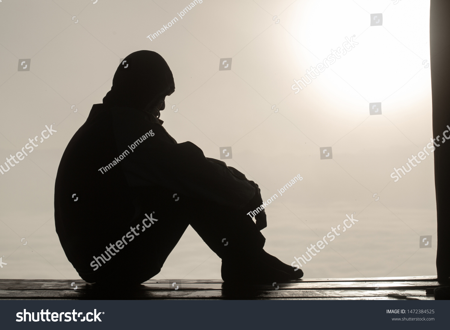 The silhouette of stressed and depressed man  of working  under pressure and hopefulness, Sad expression, sad emotion, despair, sadness. #1472384525