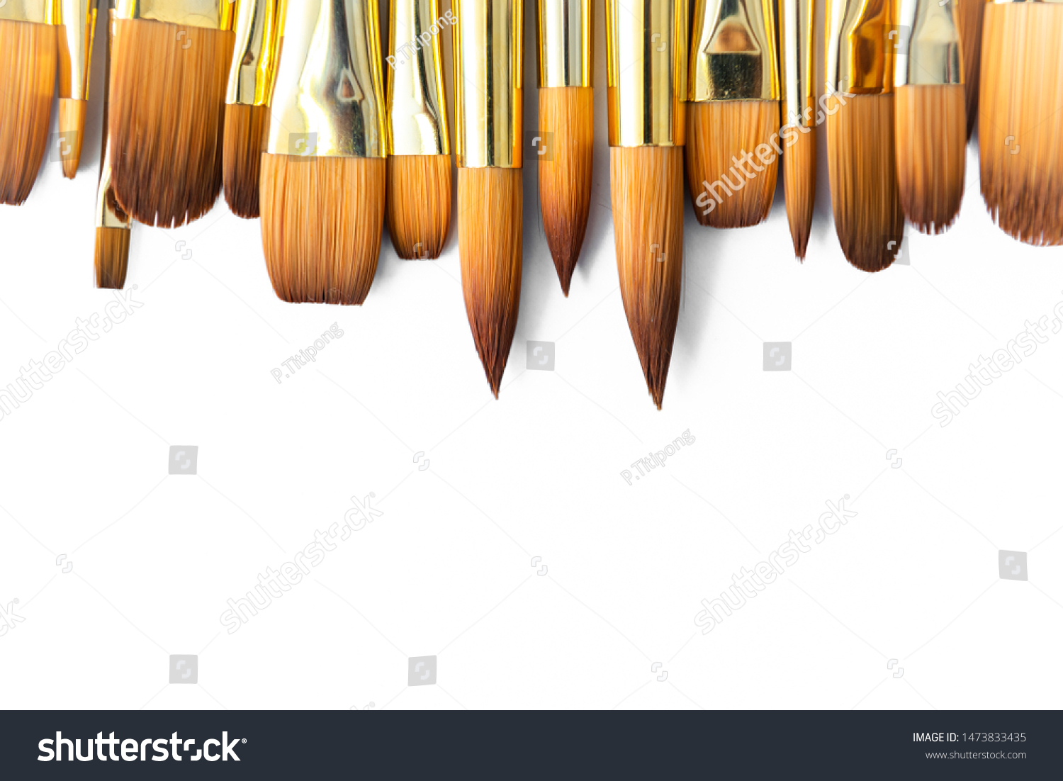 row of artist paint brushes closeup on white background, paintbrushes for wallpaper. #1473833435