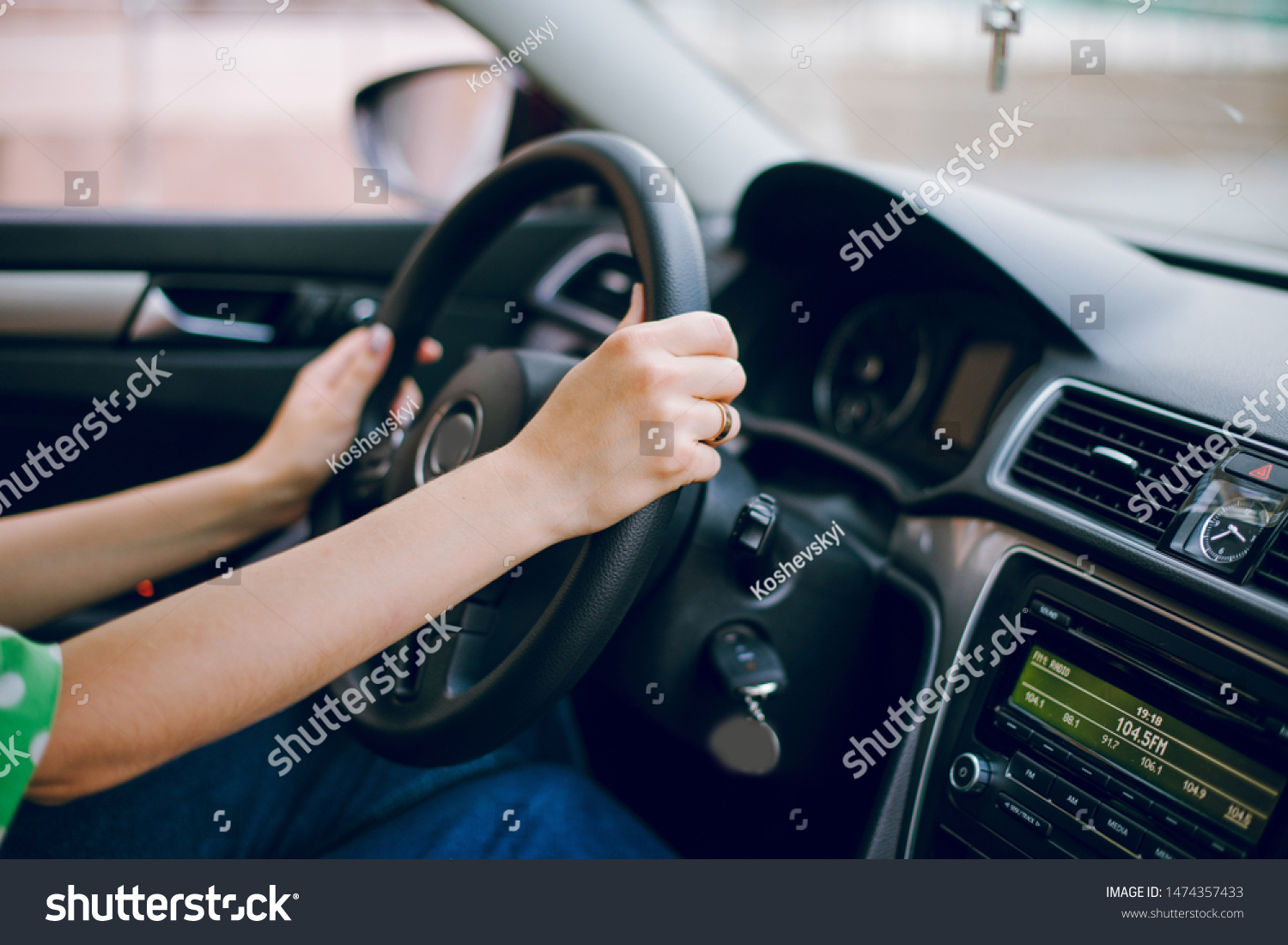 Beautiful blonde girl sitting in the car driving listening to music and drinking coffee #1474357433