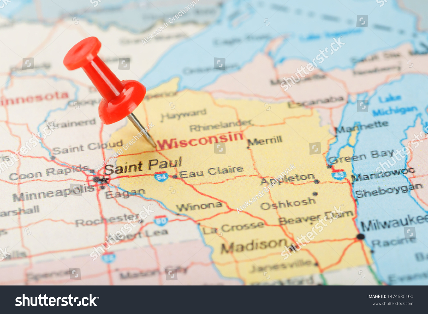 Red clerical needle on a map of USA, Wisconsin and the capital Madison. Close up map of Wisconsin with red tack #1474630100