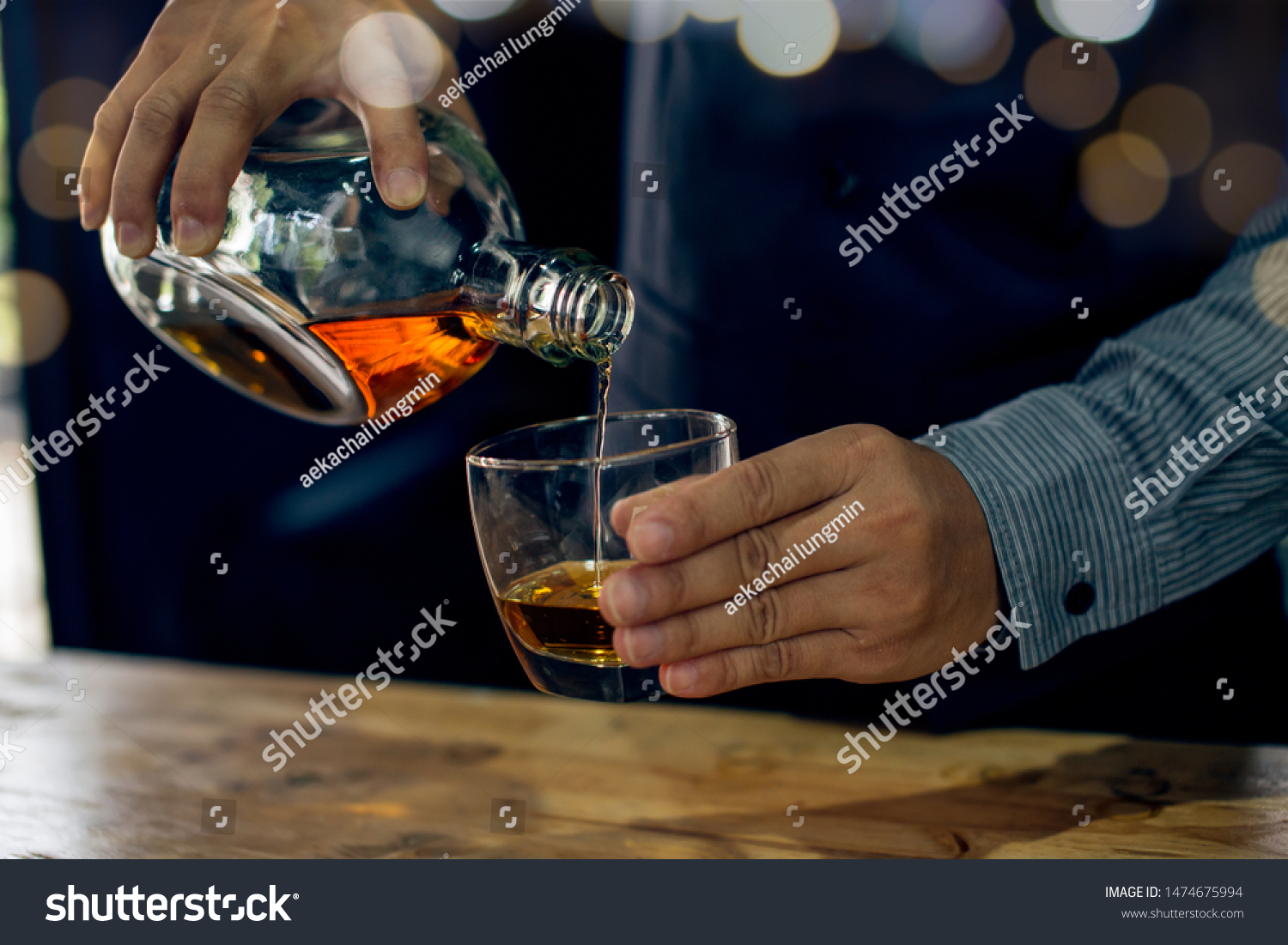 Barman pouring whiskey whiskey glass . #1474675994