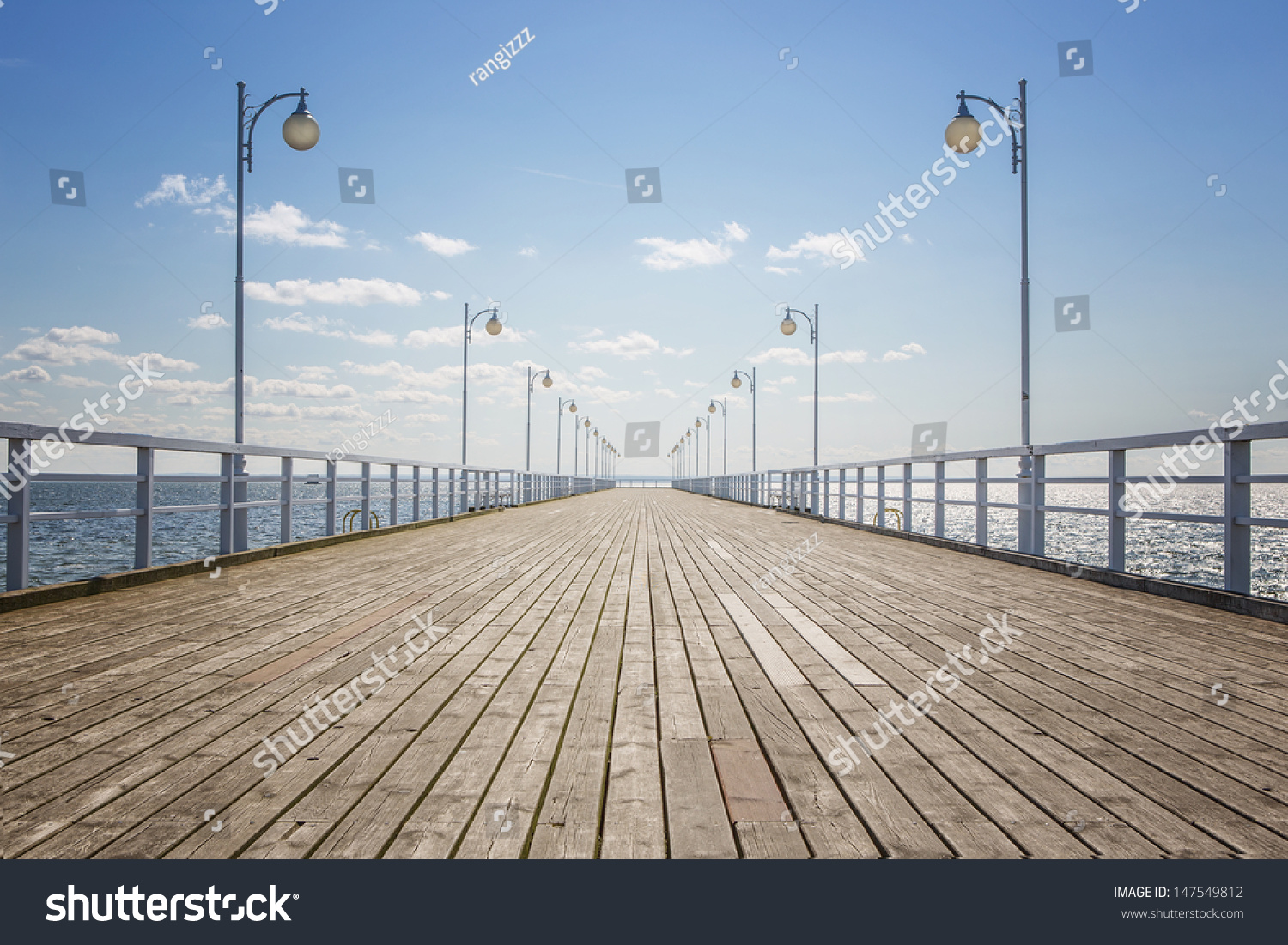 Old wooden pier over the sea shore with copy space #147549812
