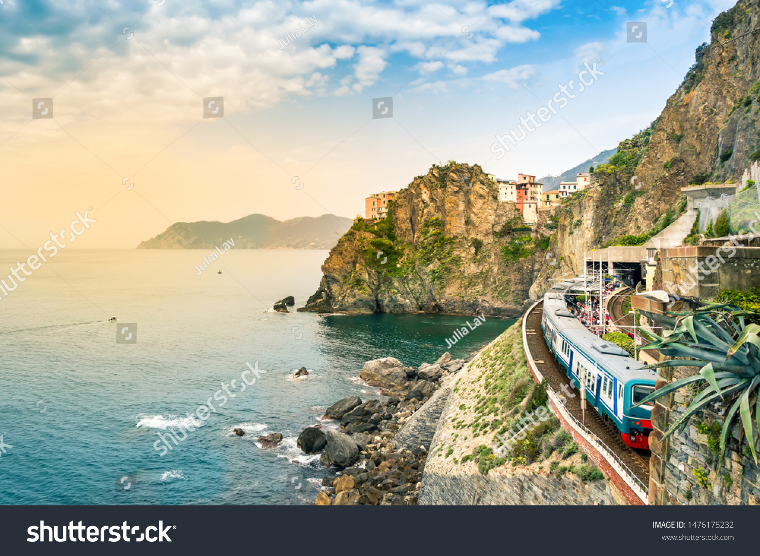 Manarola, Cinque Terre - train station in small village with colorful houses on cliff overlooking sea. Cinque Terre National Park with rugged coastline is famous tourist destination in Liguria, Italy #1476175232