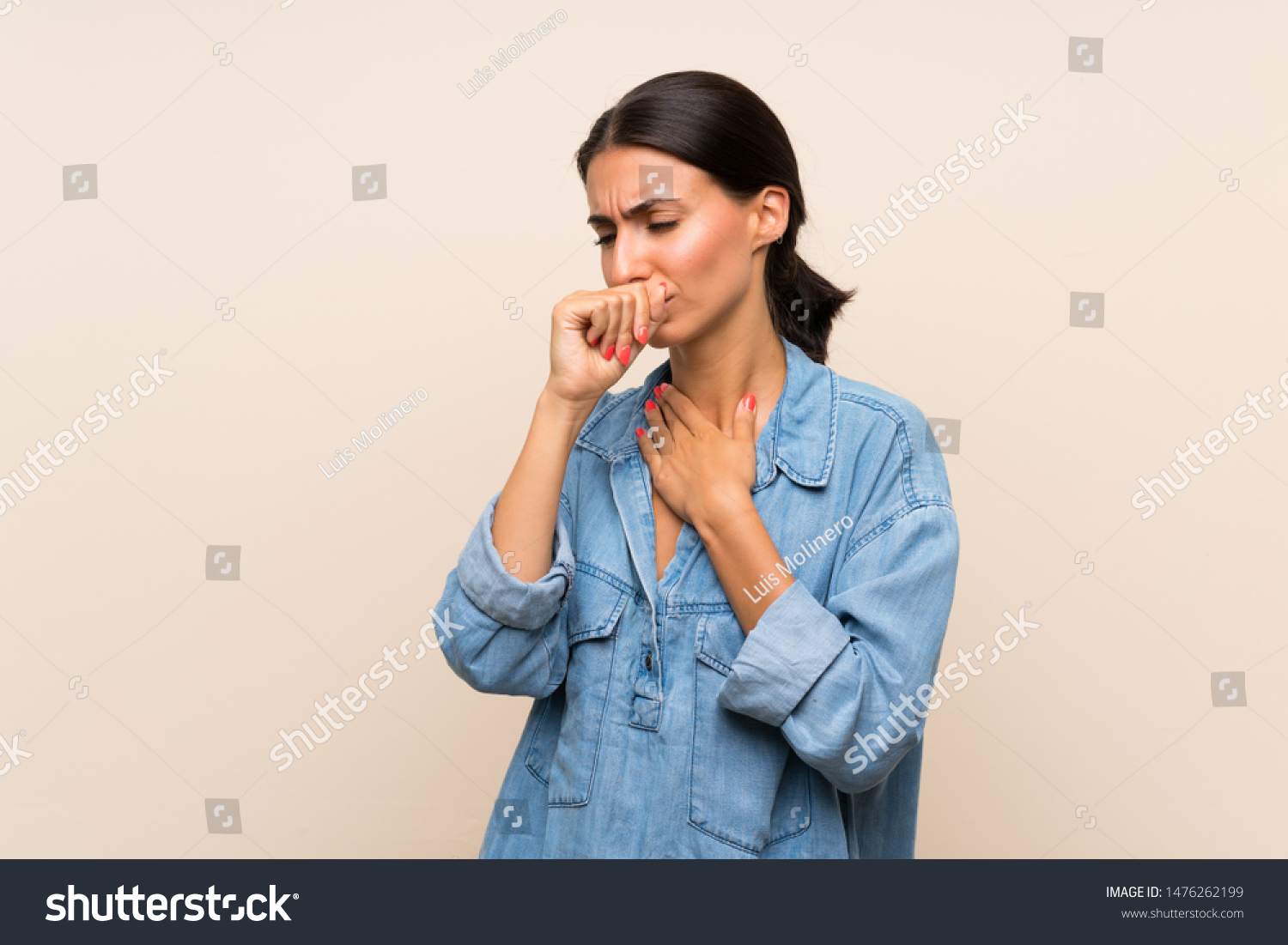 Young woman over isolated background is suffering with cough and feeling bad #1476262199