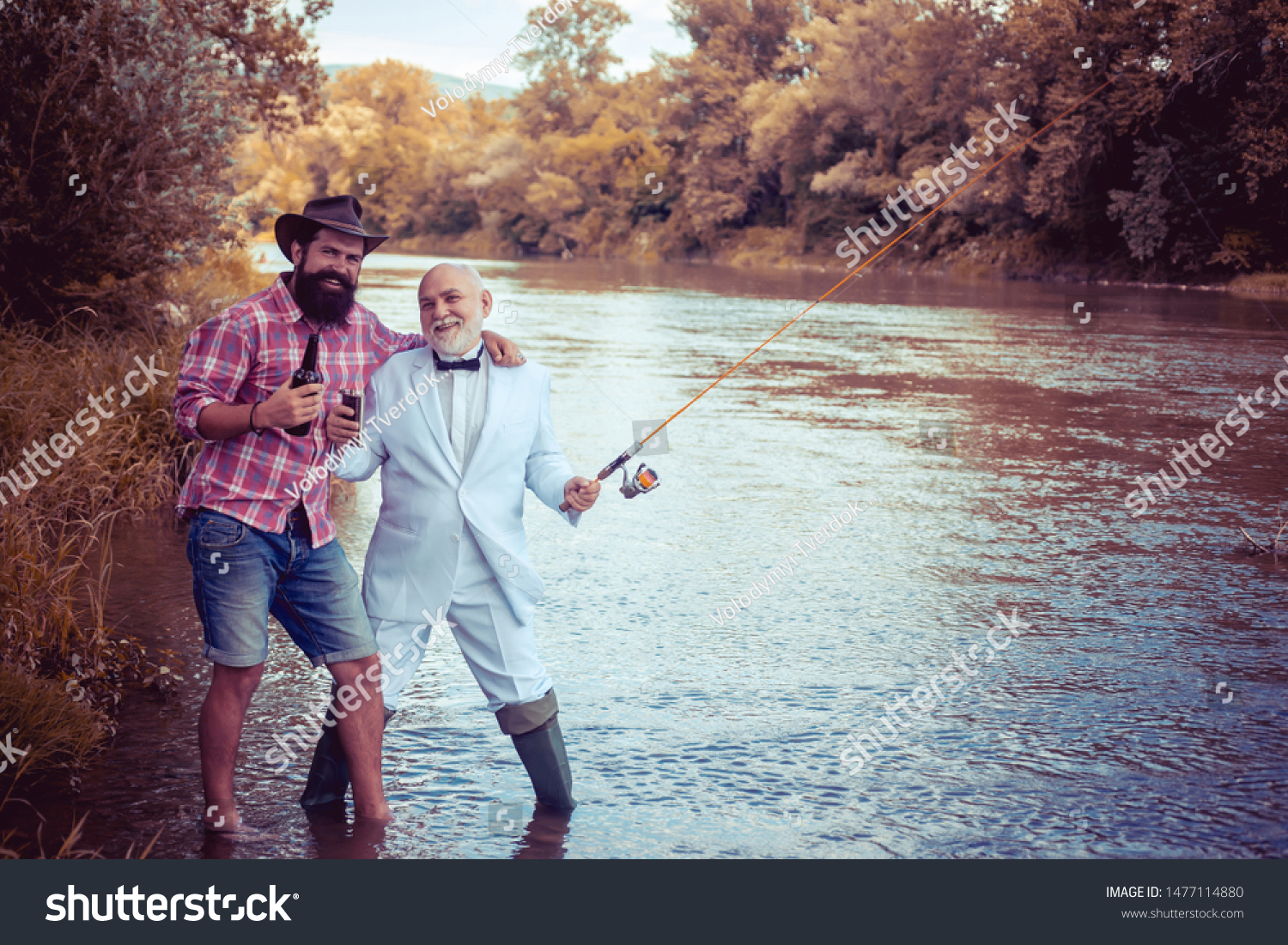 Fly fishing is most renowned as a method for catching trout grayling and salmon. Fly fisherman using fly fishing rod in beautiful river. Man fisherman catches a fish #1477114880