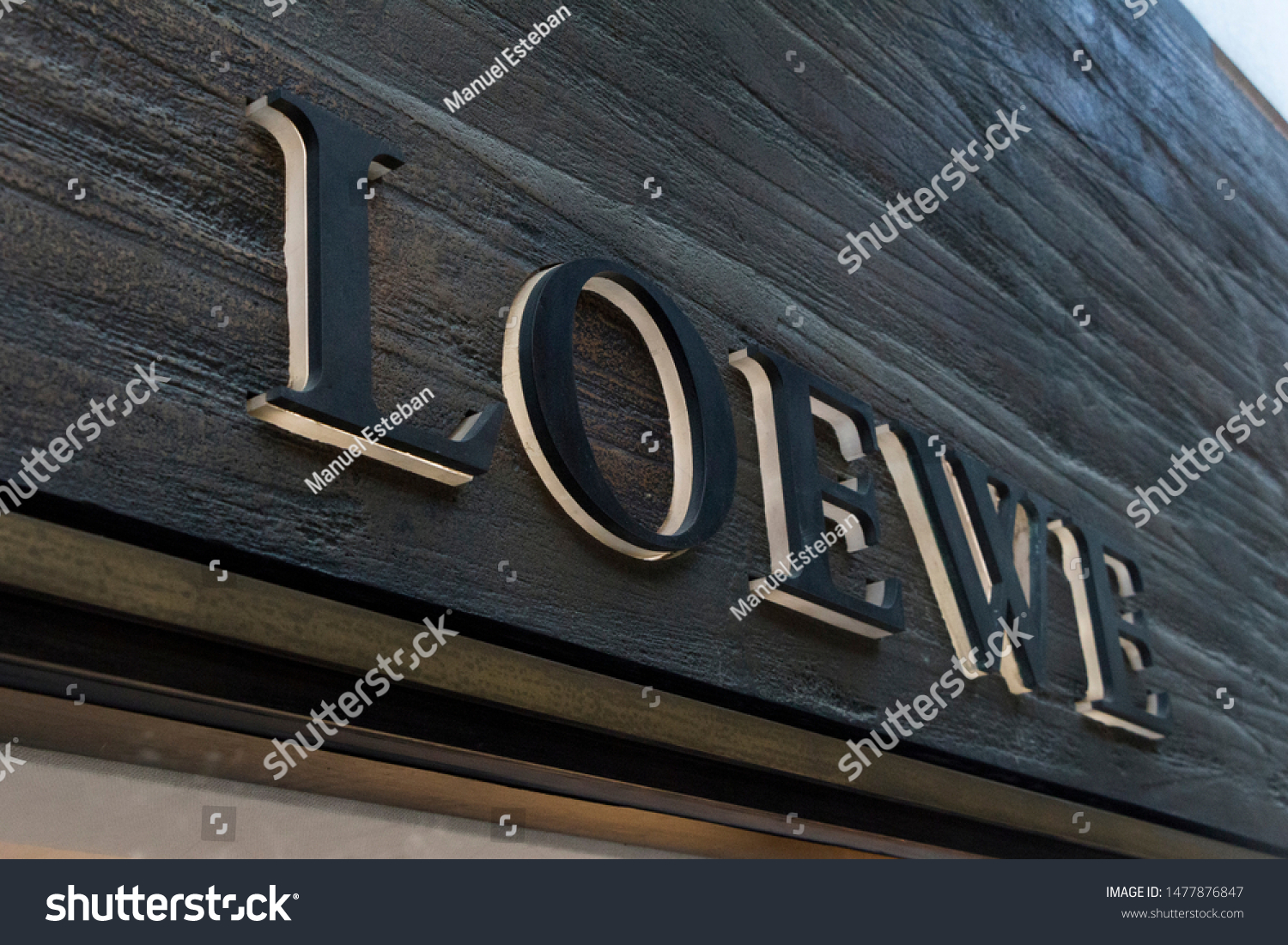 VALENCIA, SPAIN - JULY 18, 2019. Loewe logo on Loewe building. Loewe is a Spanish luxury fashion house #1477876847