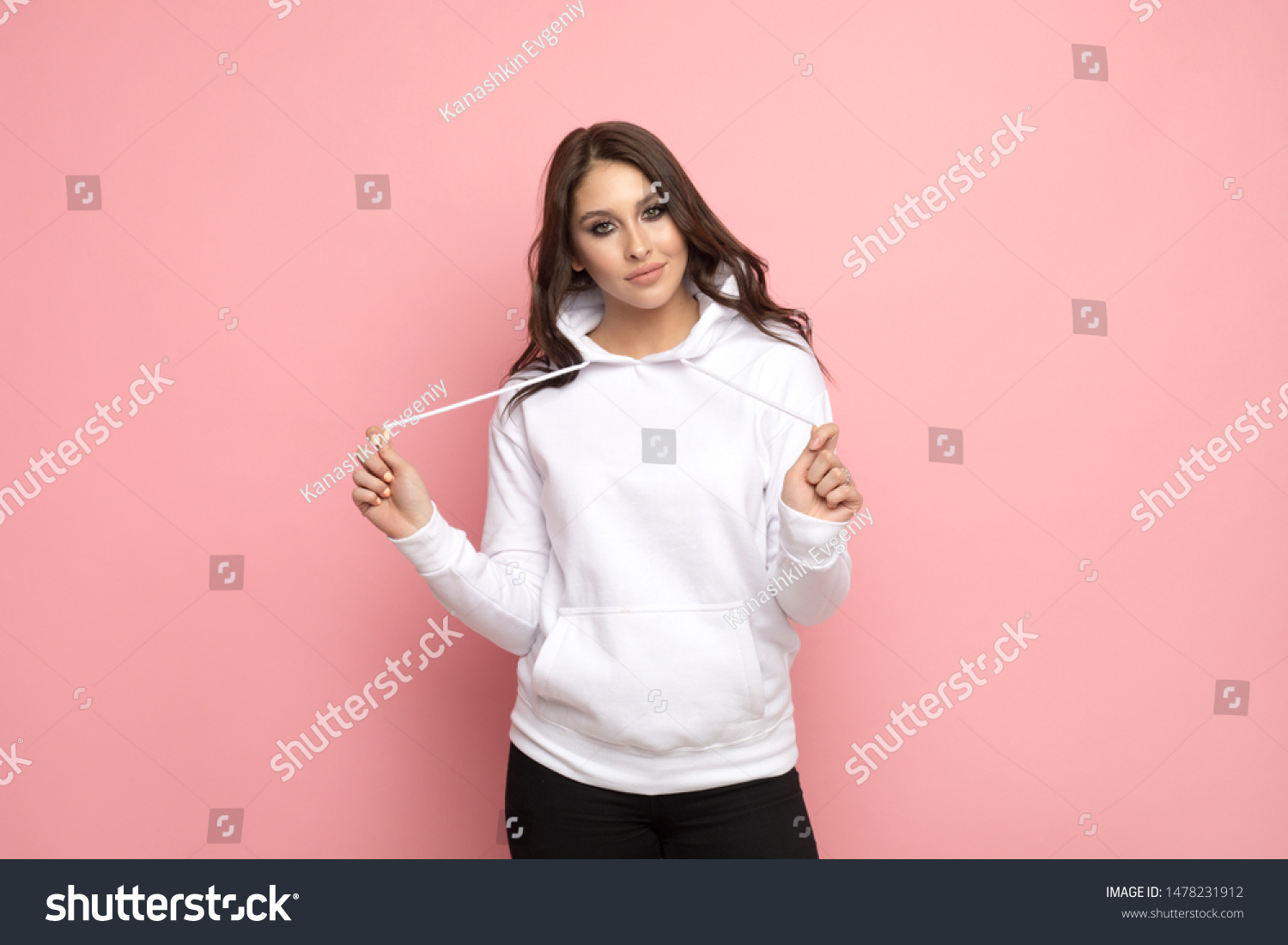 Attractive young woman in a white hoodie. Mock-up. #1478231912