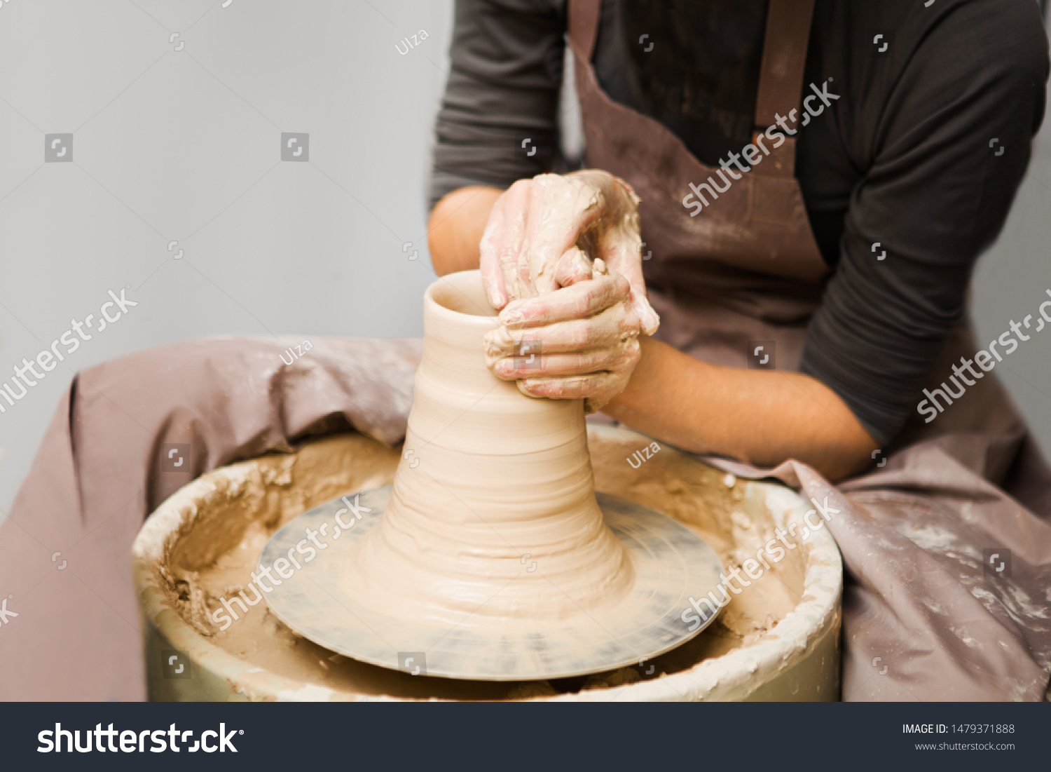 woman hands making ceramic pot on pottery wheel in workshop. hobby on pension
 #1479371888